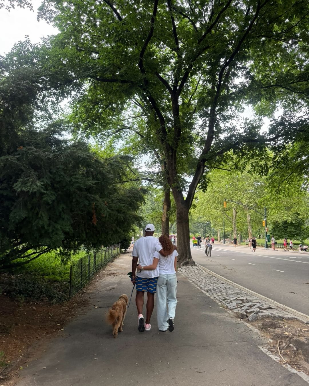 Michael Strahan shares a quiet walk with one of his daughters and their dog, offering a touching contrast to the family's glamorous public appearances. | Source: Instagram/michaelstrahan