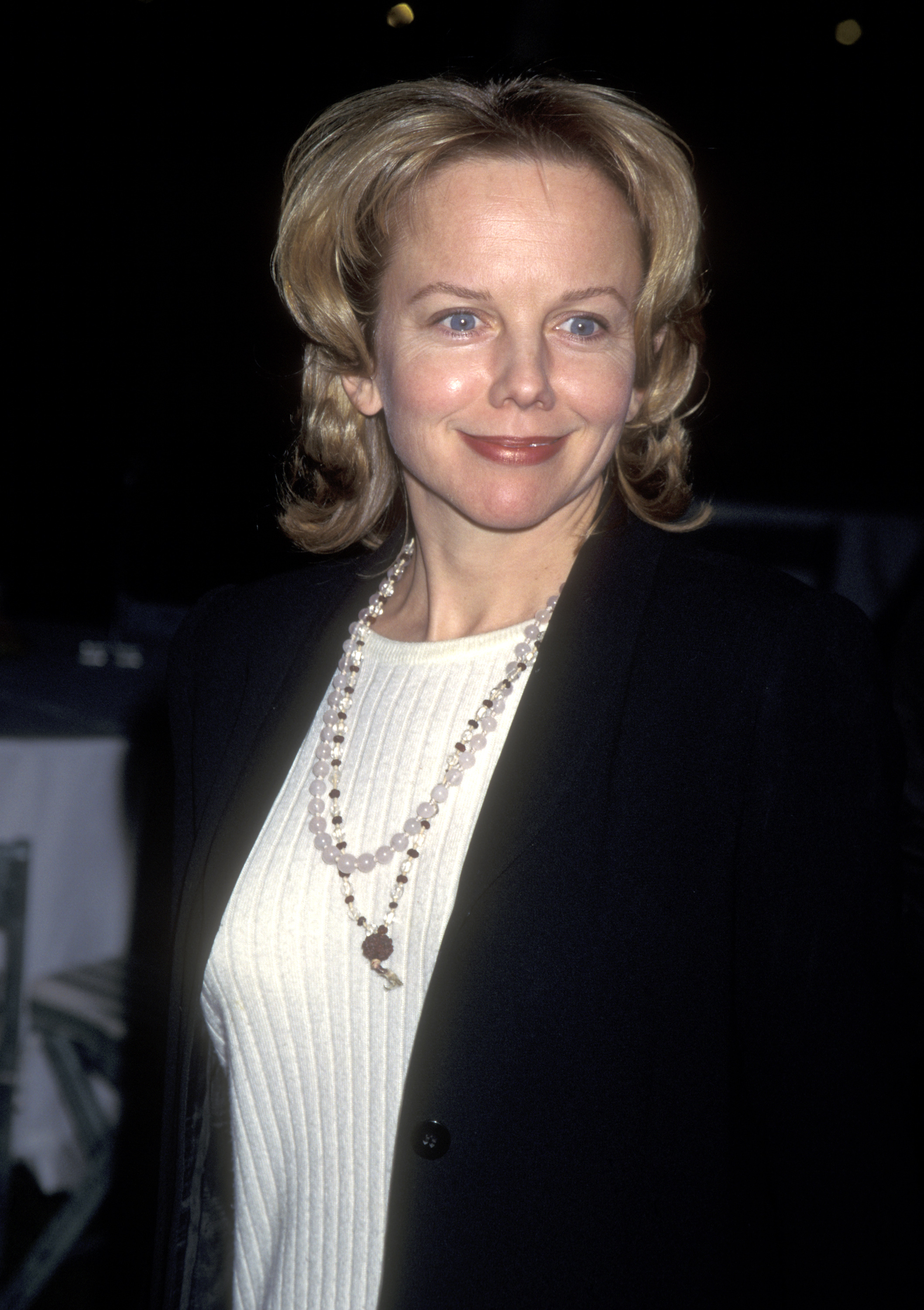 Attending the Hollywood premiere of "Eye for an Eye" at Paramount Studios on January 11, 1996, 40-year-old Linda Purl displayed the poised, sophisticated confidence of entering a new decade. Her dewy complexion and delicate smile lines were complemented by a layered, center-parted bob that framed her features, paired effortlessly with a cream ribbed top, a black tailored blazer, and beaded necklace strands. | Source: Getty Images
