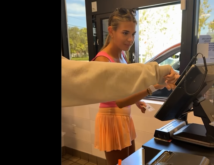 Kai Trump works the register with help from a coworker, dated June 17, 2025 | Source: Instagram/kaitrumpgolfer