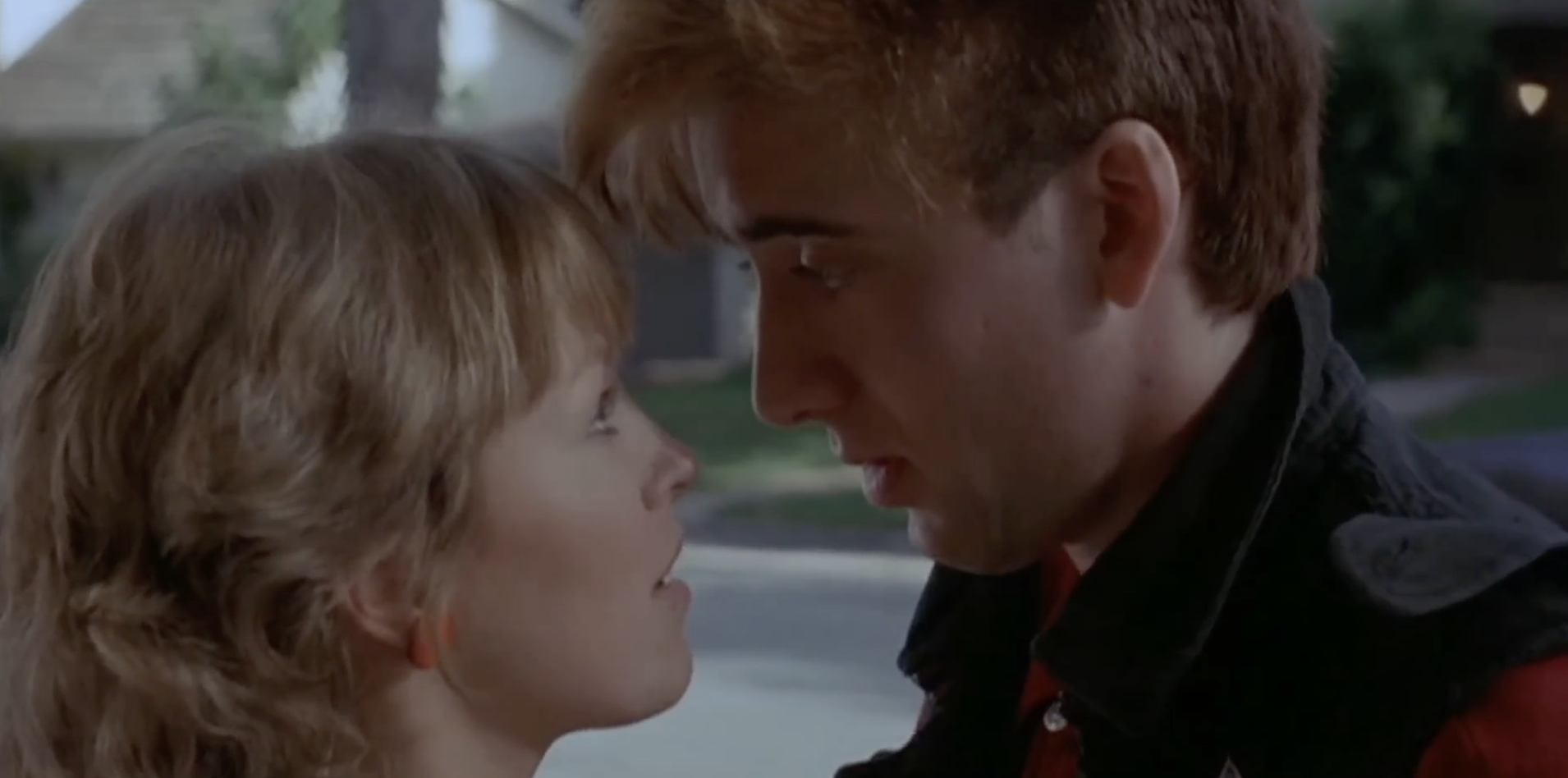 Of course! We're talking about Deborah Foreman, who starred in "Valley Girl" next to Nicolas Cage. Weren't they so young here? | Source: YouTube/Movieclips