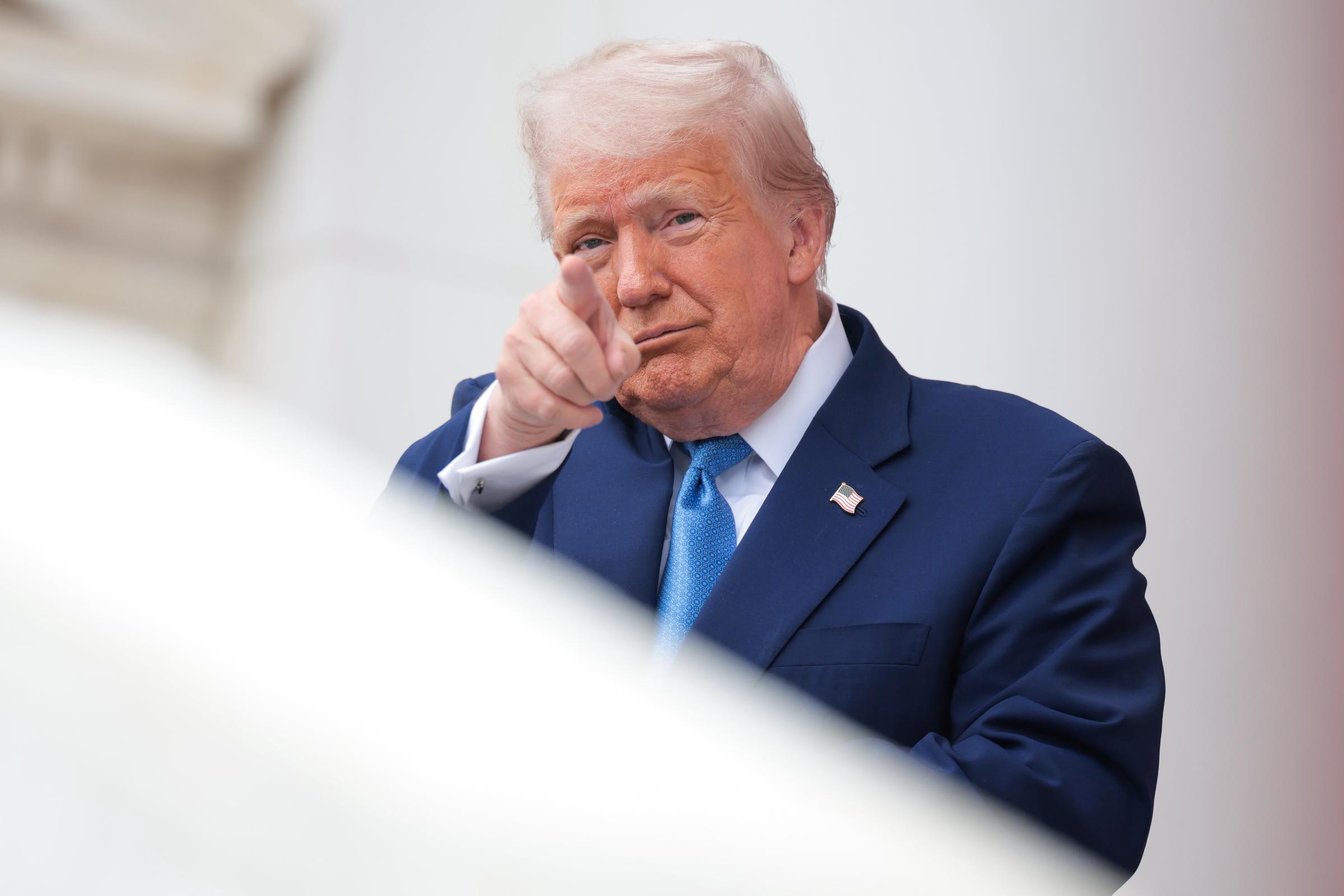 Donald Trump speaks during the wreath-laying ceremony at the Memorial Amphitheater in Arlington National Cemetery on May 26, 2025, in Virginia | Source: Getty Images
