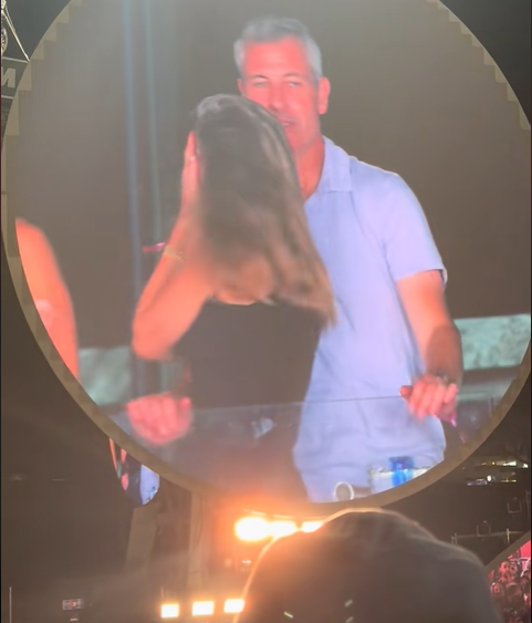 Kristin Cabot hiding her face away from the kiss cam after realizing she's being broadcast, from a video post dated July 17, 2025 | Source: TikTok/instaagraace