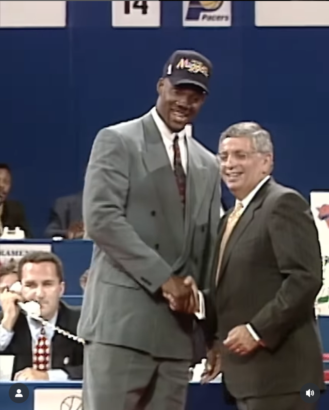 Rodney Rogers shakes hands with NBA Commissioner David Stern after being selected ninth overall by the Denver Nuggets. | Source: Instagram/nbahistory