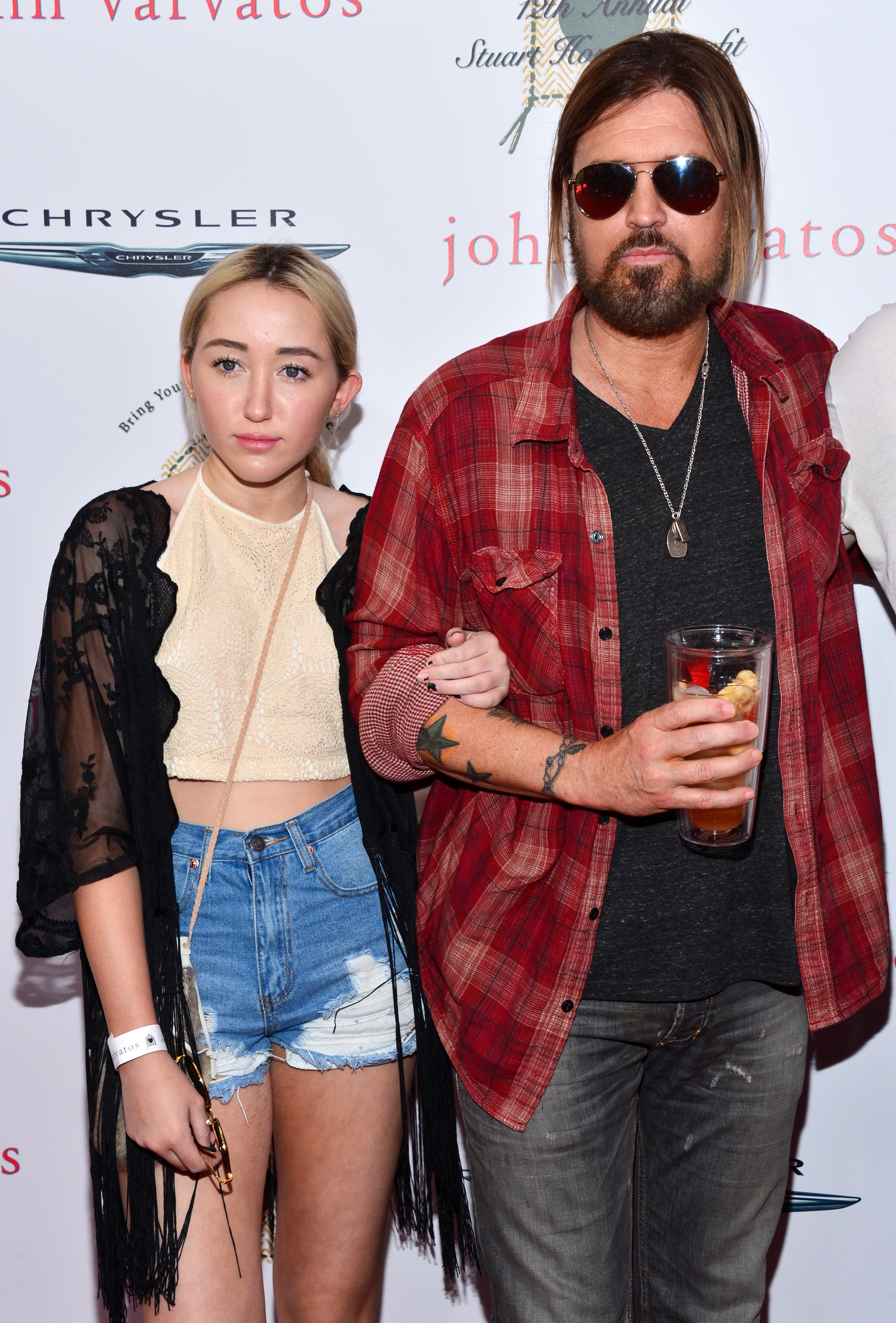 Billy Ray Cyrus and his daughter Noah arrive at the 12th Annual John Varvatos Stuart House Benefit in Los Angeles on April 26, 2015. | Source: Getty Images