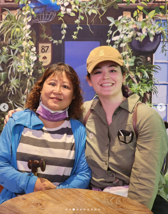 Meiling and Stefany pose together in front of a vibrant backdrop, smiling side by side after 25 years apart. | Source: Instagram/booksbystefany