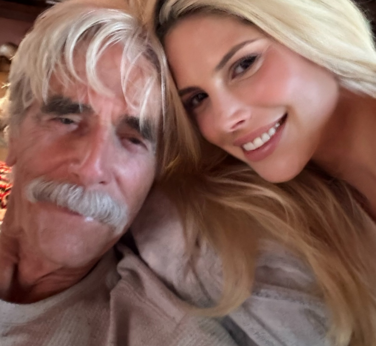 In an intimate, up-close selfie shared to Instagram on January 7, 2026, Cleo Rose Elliott leaned affectionately against her father, Sam Elliott. The father-daughter pair smiled softly for the camera, with Sam sporting his signature silver hair and thick mustache in a cozy thermal top, while Cleo beamed beside him with radiant makeup and long, tousled blonde hair framing her face.
