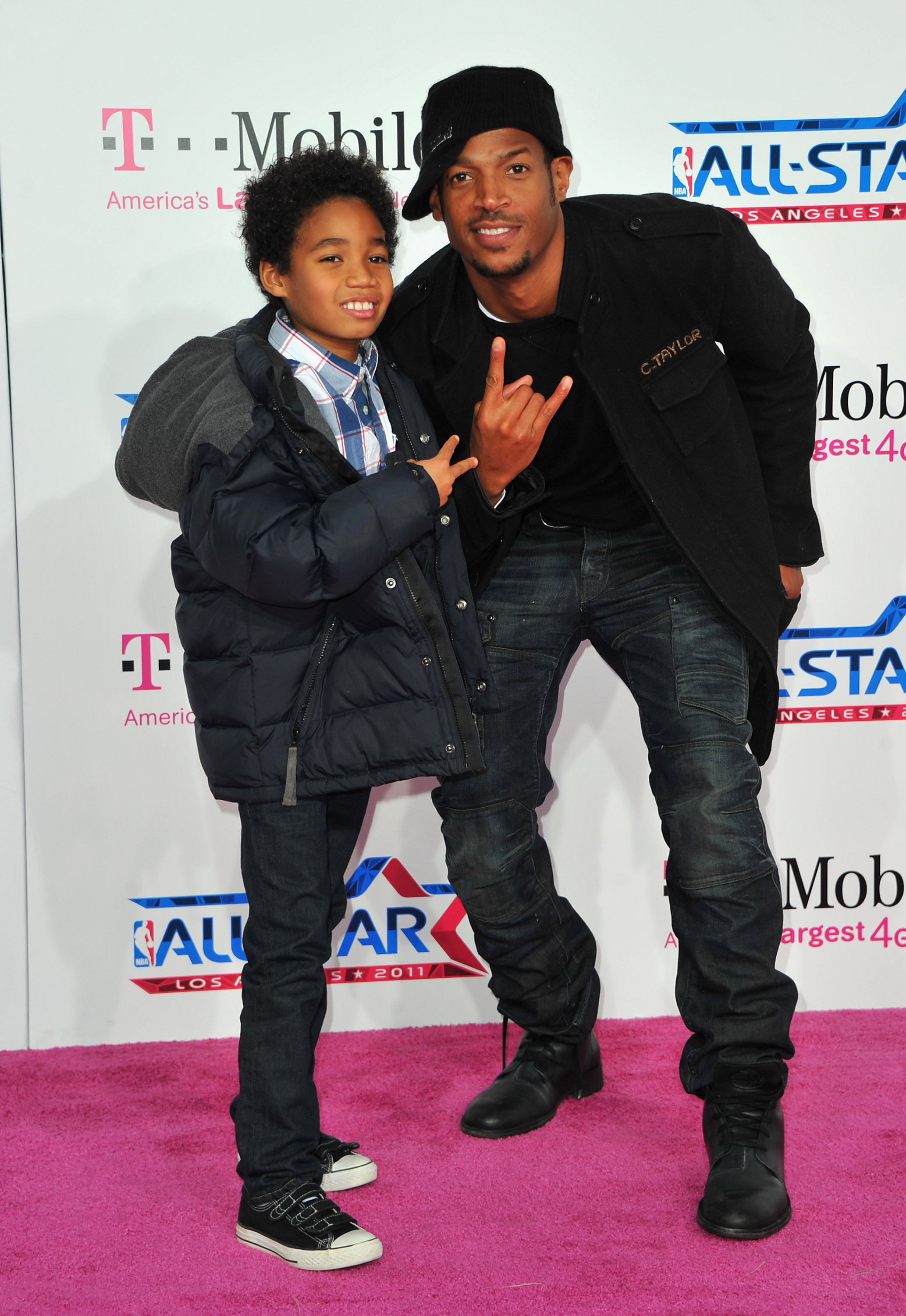Marlon Wayans and son Shawn Wayans arrive to the T-Mobile Magenta Carpet at the NBA All-Star Game on February 20, 2011, in Los Angeles, California | Source: Getty Images
