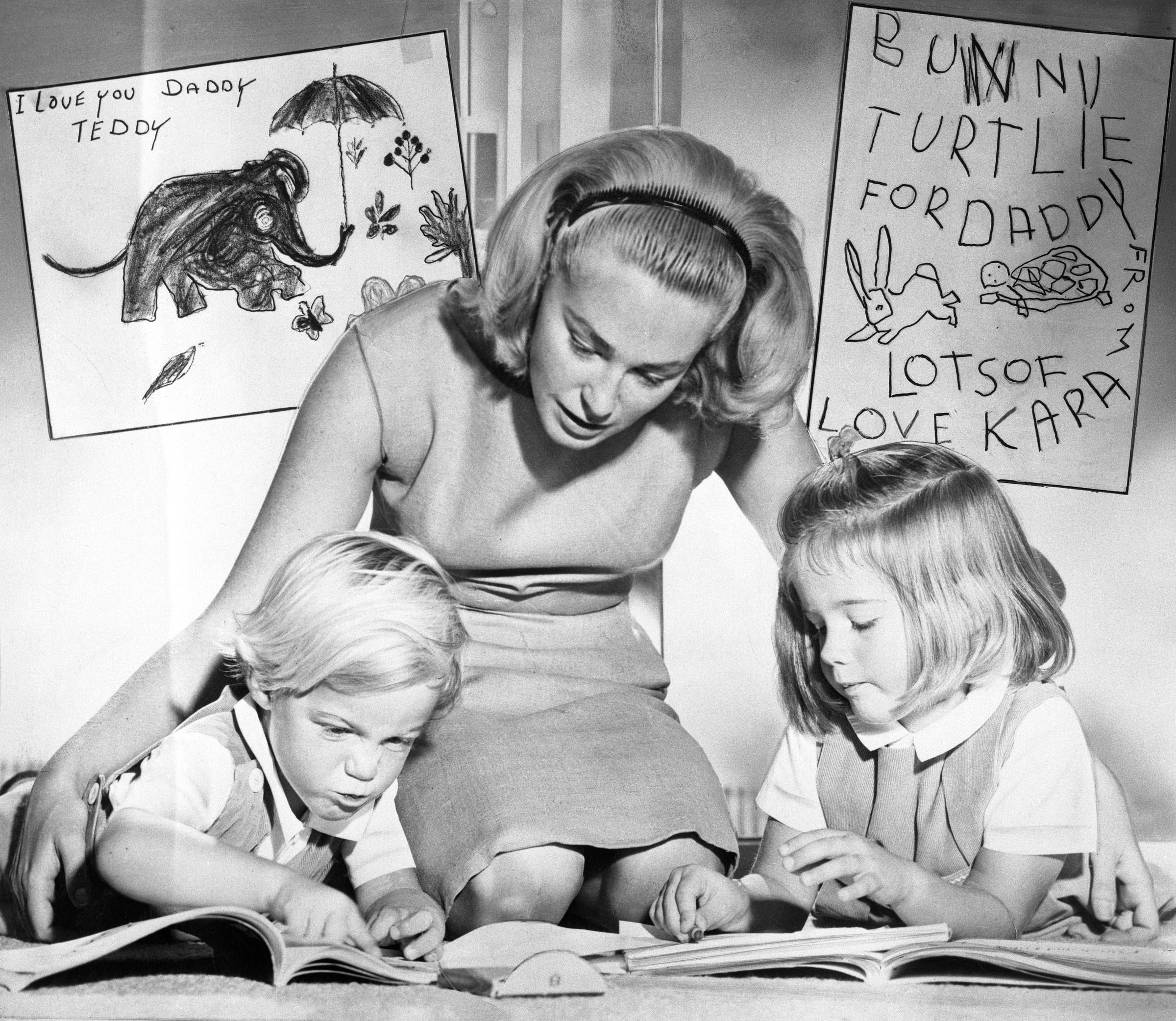 Joan Kennedy engaging with two of her kids, Ted Jr. and Kara Kennedy, in 1964. | Source: Getty Images