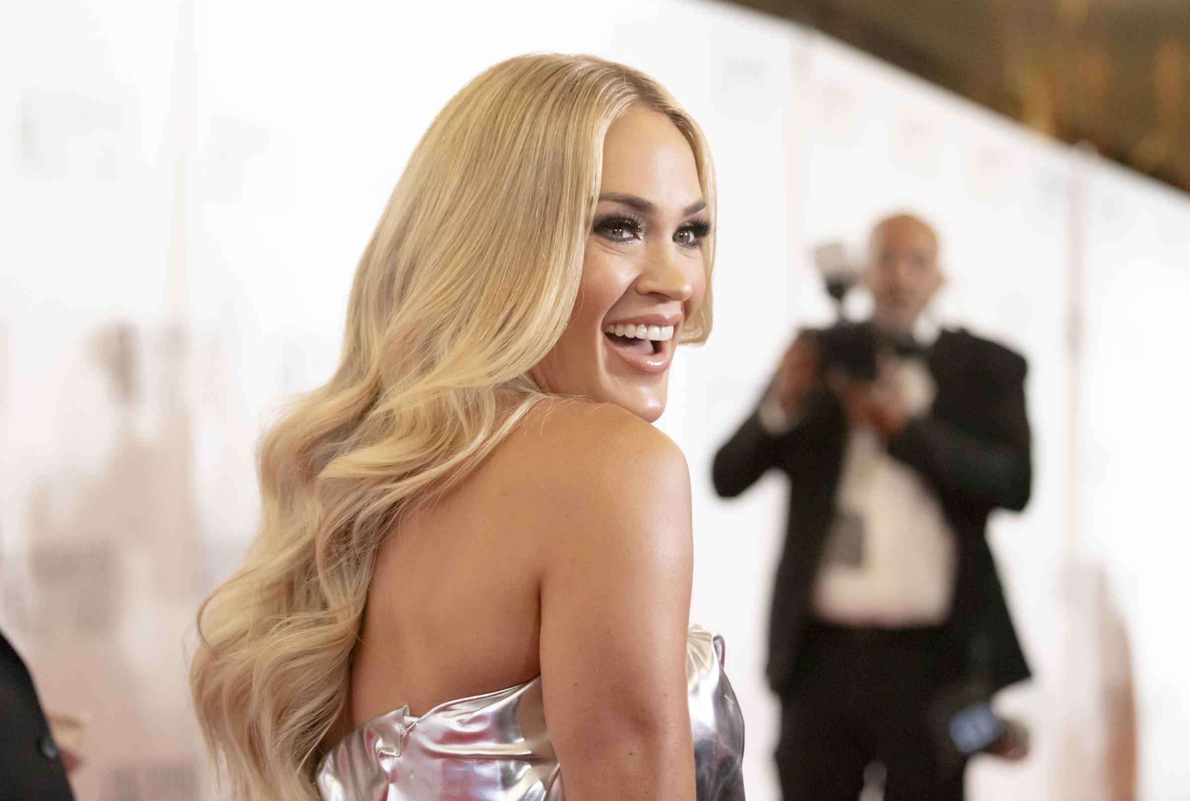 A side-profile photo from the same event highlighted Underwood's signature blonde waves as she smiled for photographers. Images from different angles frequently became part of online comparisons of her appearance over the years. | Source: Getty Images
