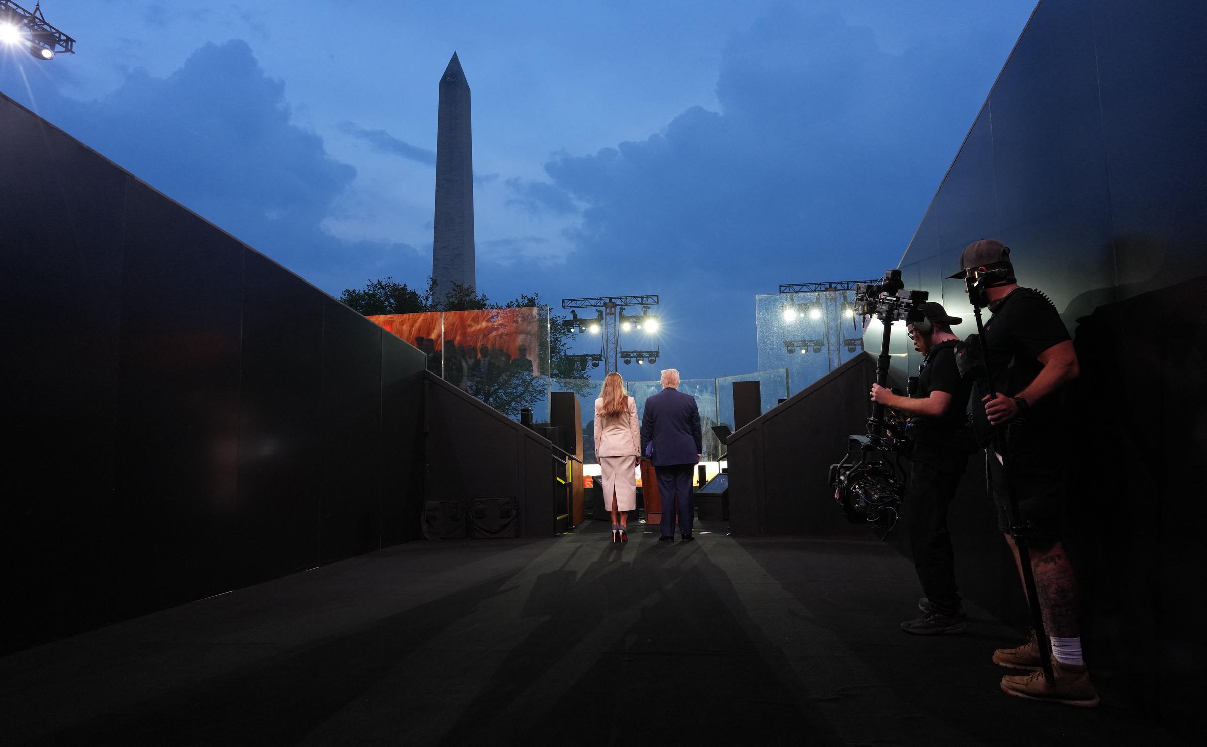 Donald and Melania Trump head on stage at the Army 250th Anniversary Parade on June 14, 2025 | Source: Getty Images