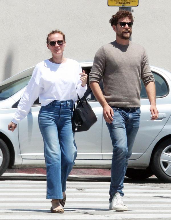 Just weeks after ending their 10-year relationship, Diane Kruger and Joshua Jackson were photographed taking a stroll in Los Angeles on August 15, 2016. Jackson carried what appeared to be a bottle of wine, while a source described the former couple as "just friends." | Source: Getty Images