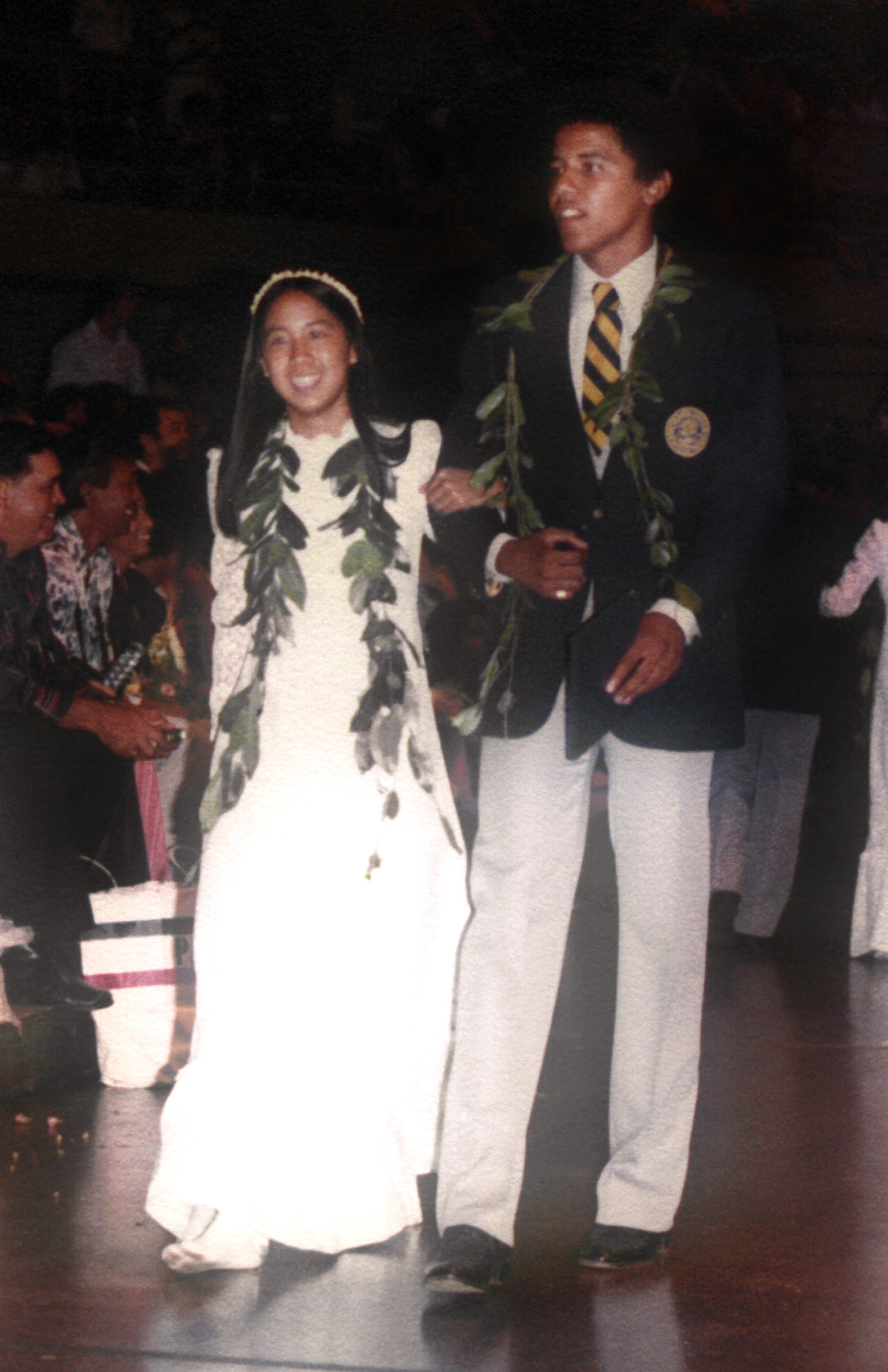 Barack Obama escorts Laura Kong during the graduation ceremony at Punahou School in May 1979, in Honolulu, Hawaii | Source: Getty Images