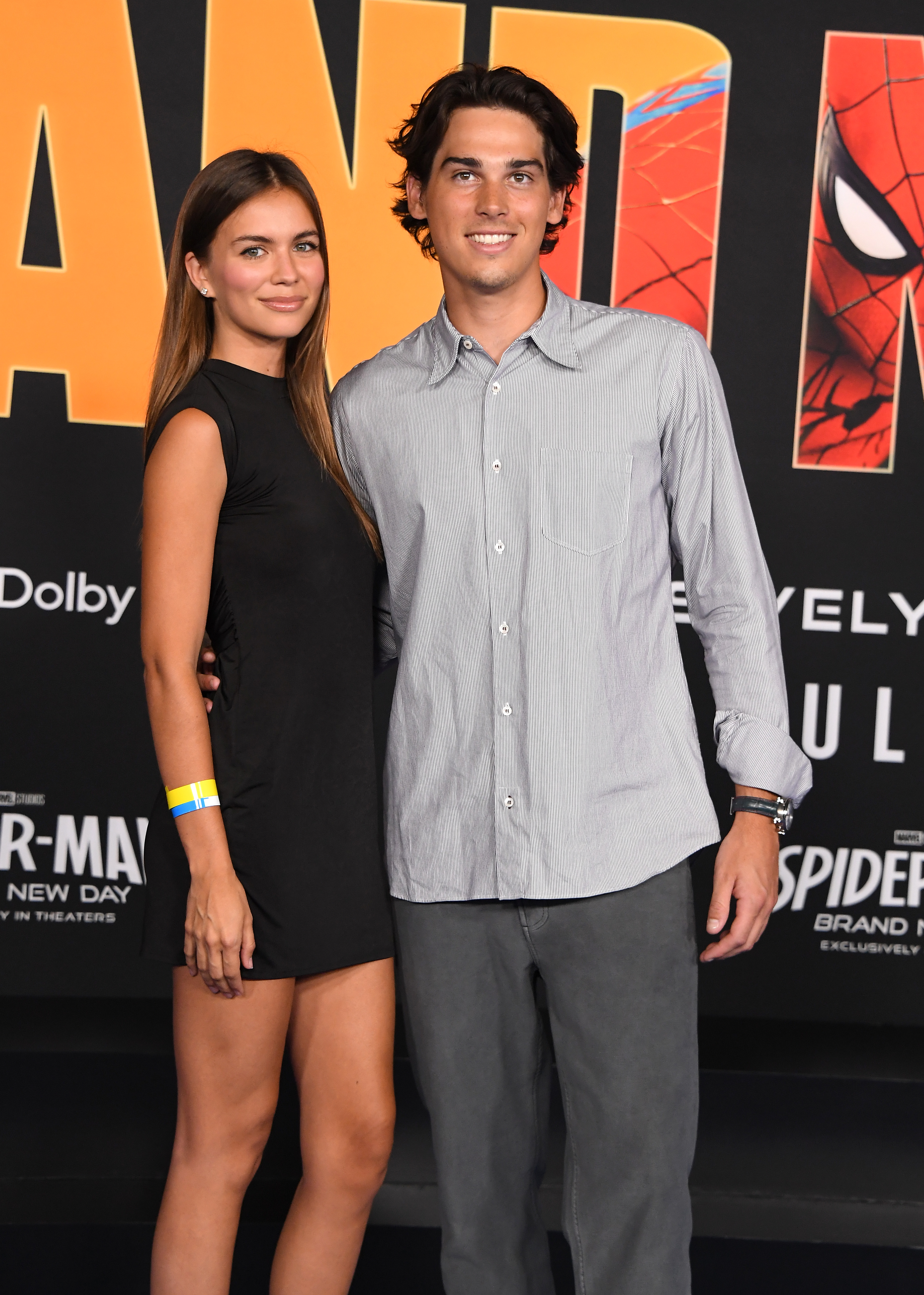 Paris and his girlfriend, Alex Lee-Aillón, made a stylish appearance at the "Spider-Man: Brand New Day" premiere. The latest photos gave fans another look at how much Pierce Brosnan's youngest son has changed, prompting many to compare his features to both of his parents.