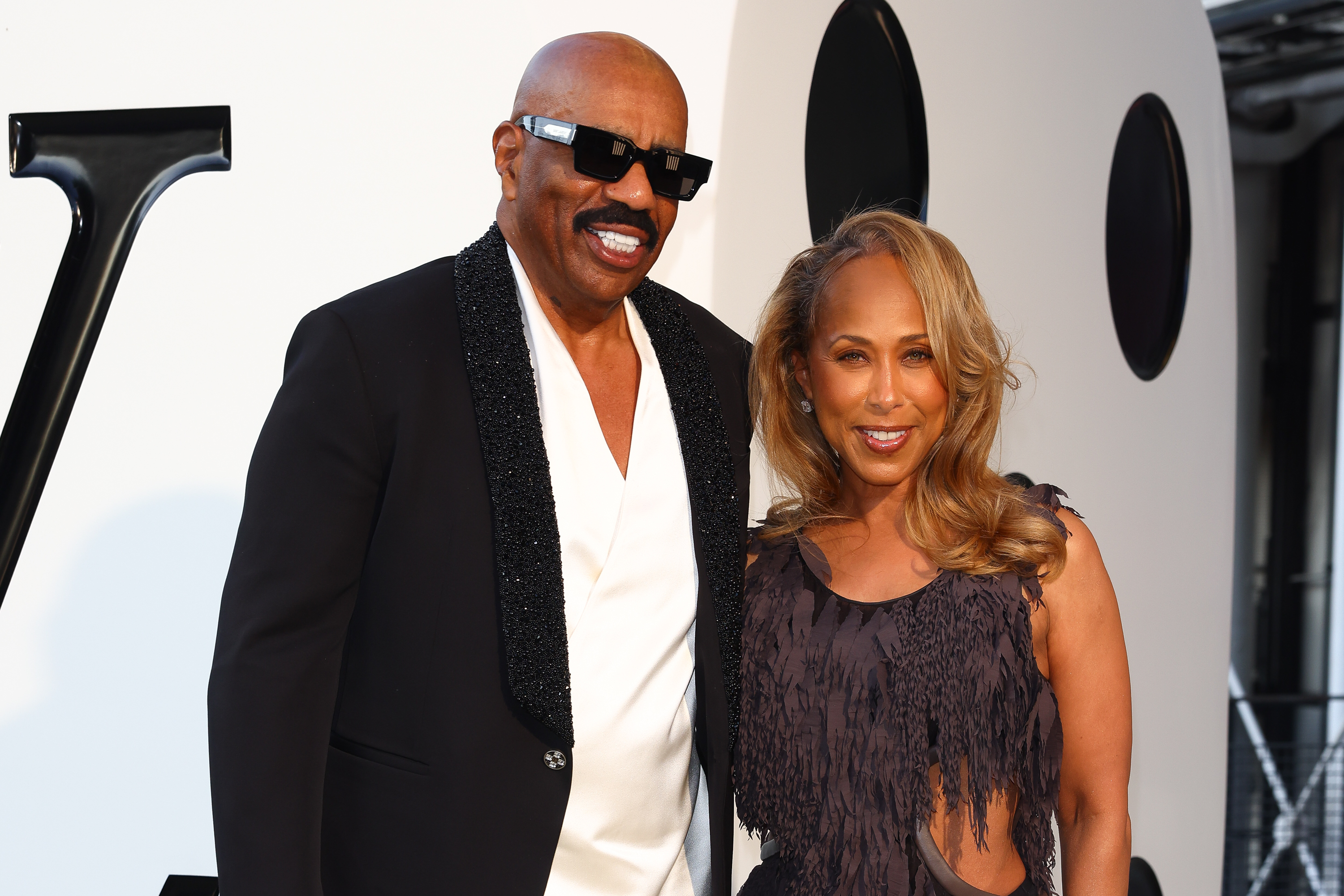 Majorie and her husband, TV star Steve Harvey smile at the camera during the Paris Fashion Week in Paris, Franco on June 24, 2025 | Source: Getty Images