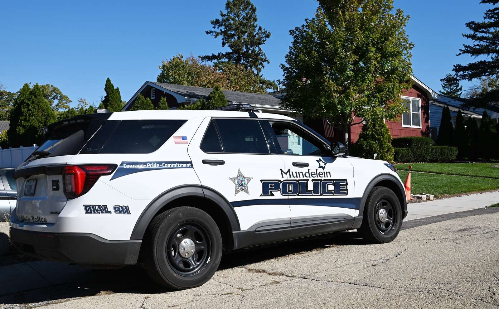 By Tuesday, much of the police activity had subsided, but a marked Mundelein Police SUV remained parked outside the Schmidt family home as the investigation continued. | Source: Joe Lewnard / Daily Herald.