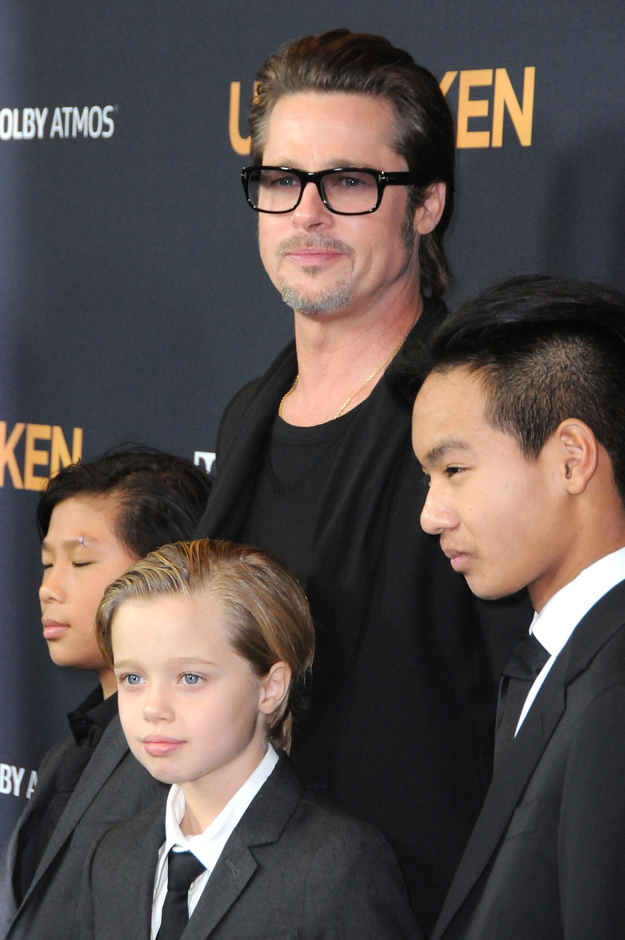 Brad Pitt with his sons, Pax, Shiloh, and Maddox, at the premiere of "Unbroken" at TCL Chinese Theatre IMAX on December 15, 2014, in Hollywood, California. | Source: Getty Images
