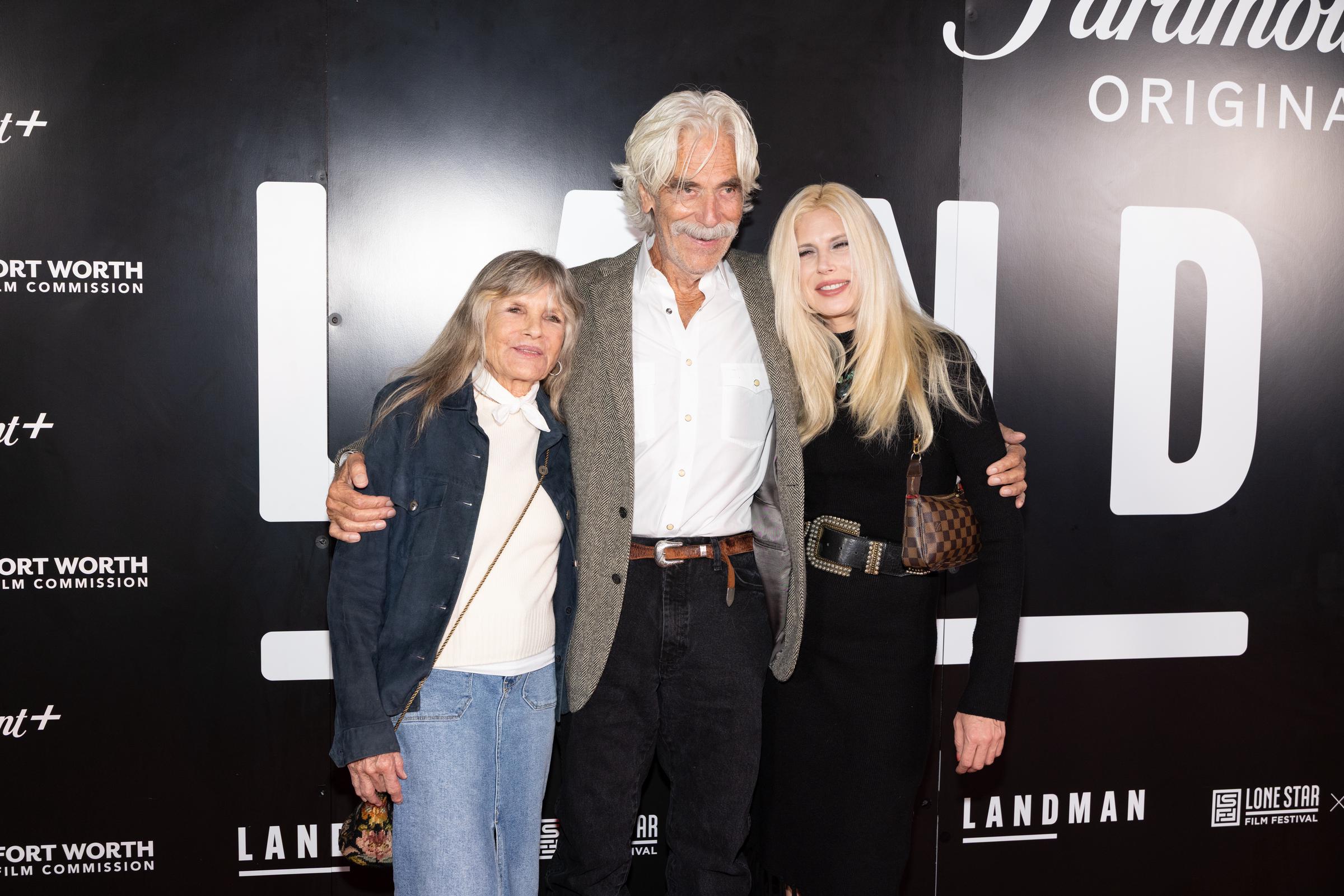 Katharine Ross and Cleo Rose Elliott stood on either side of Sam Elliott at the advance screening of "Landman" season two at the Modern Art Museum of Fort Worth on November 6, 2025, in Fort Worth, Texas. Sam beamed in a tweed blazer over an open-collar white shirt and dark jeans, flanked by Katharine in a casual blue denim jacket with light-wash jeans and Cleo in a chic black knit long-sleeve dress accented with a wide statement belt and a patterned shoulder bag. | Source: Getty Images