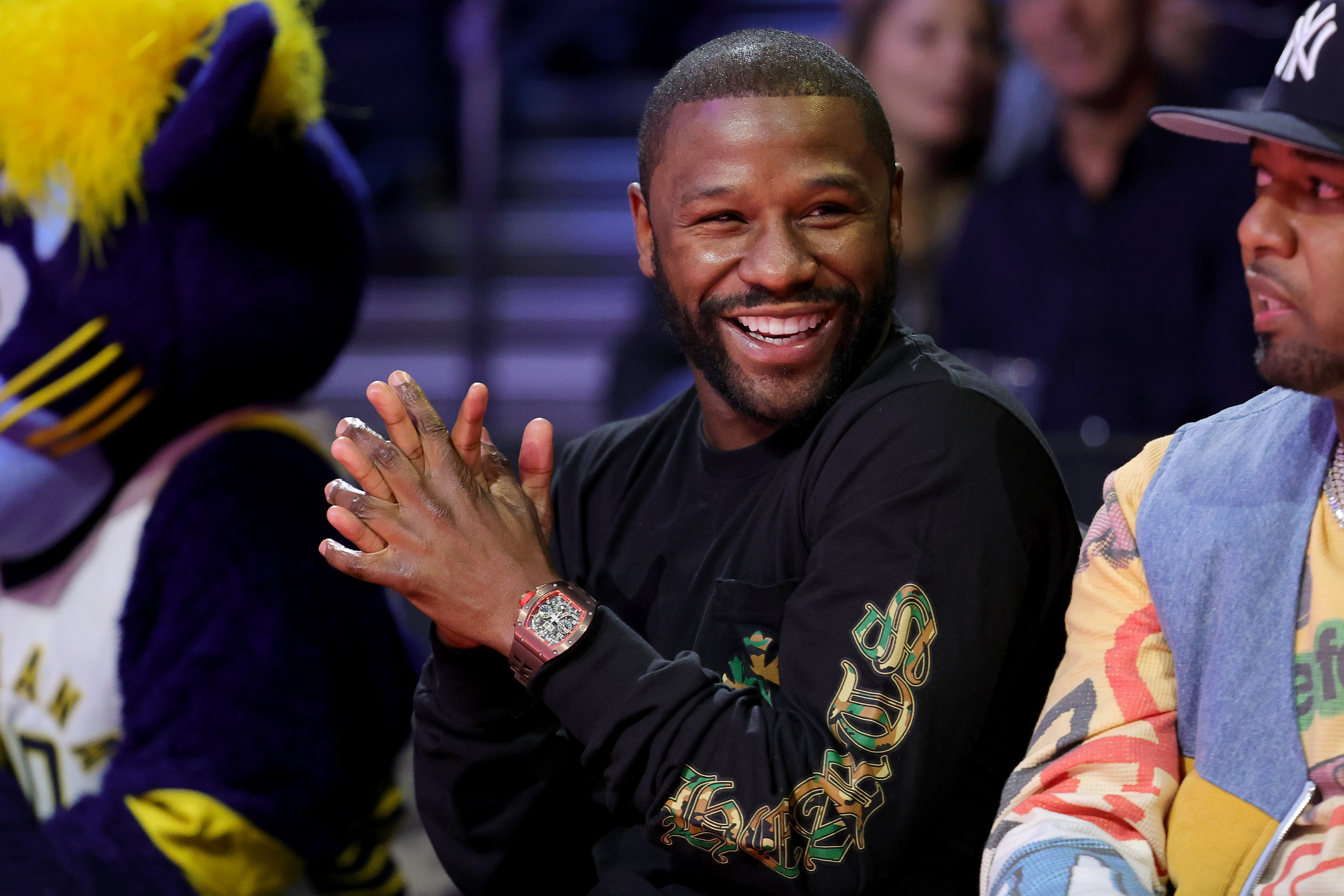 Floyd Mayweather Jr. smiles during the second quarter in the championship game between the Indiana Pacers and the Los Angeles Lakers on December 9, 2023 | Source: Getty Images