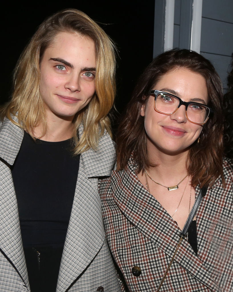 Cara Delevingne and Ashley Benson pose backstage at the new Alanis Morissette musical "Jagged Little Pill" on Broadway at The Broadhurst Theatre on November 20, 2019, in New York City | Source: Getty Images