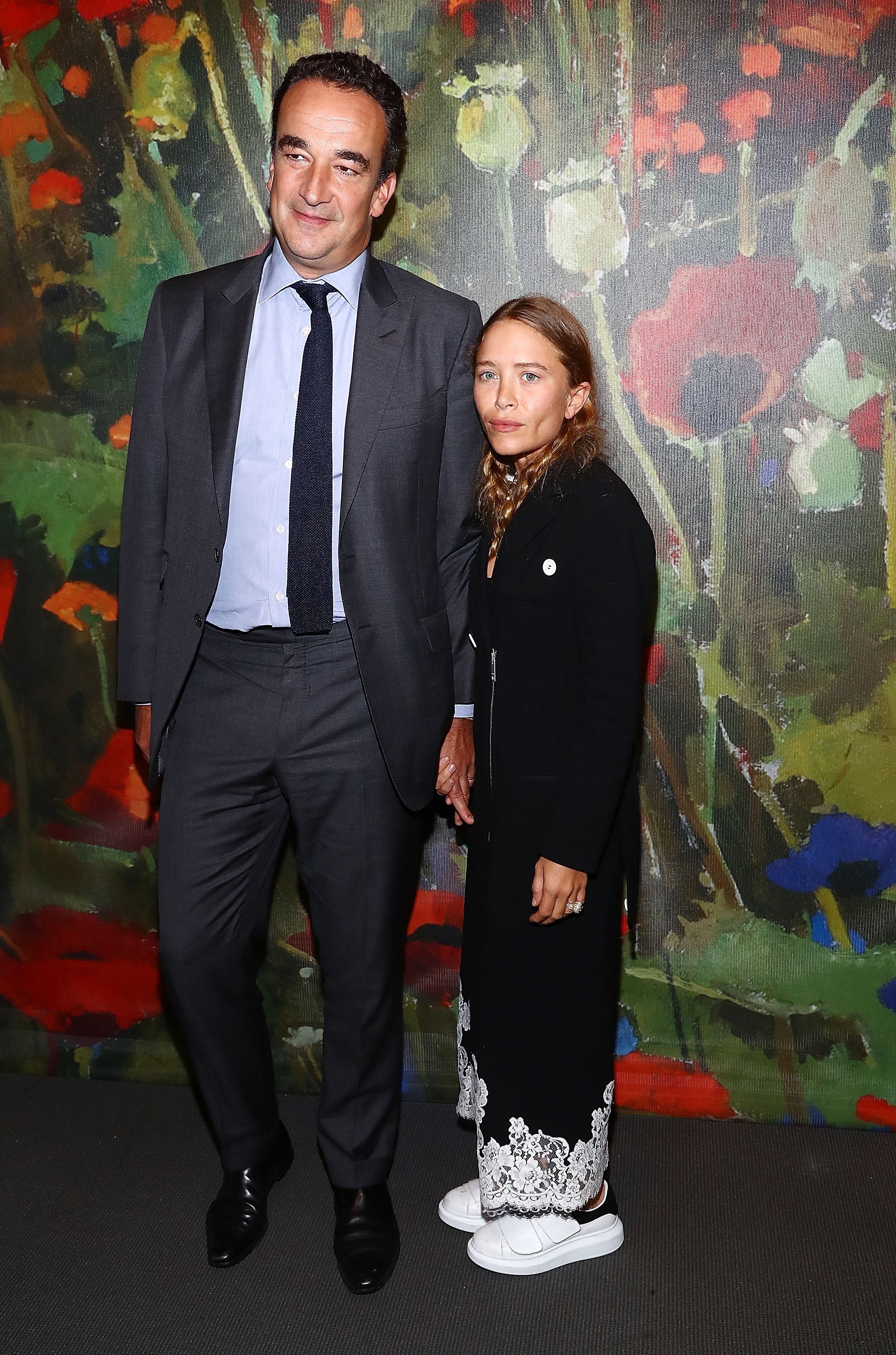 Olivier Sarkozy and the former actress during an auction at Sotheby's on October 11, 2017 | Source: Getty Images