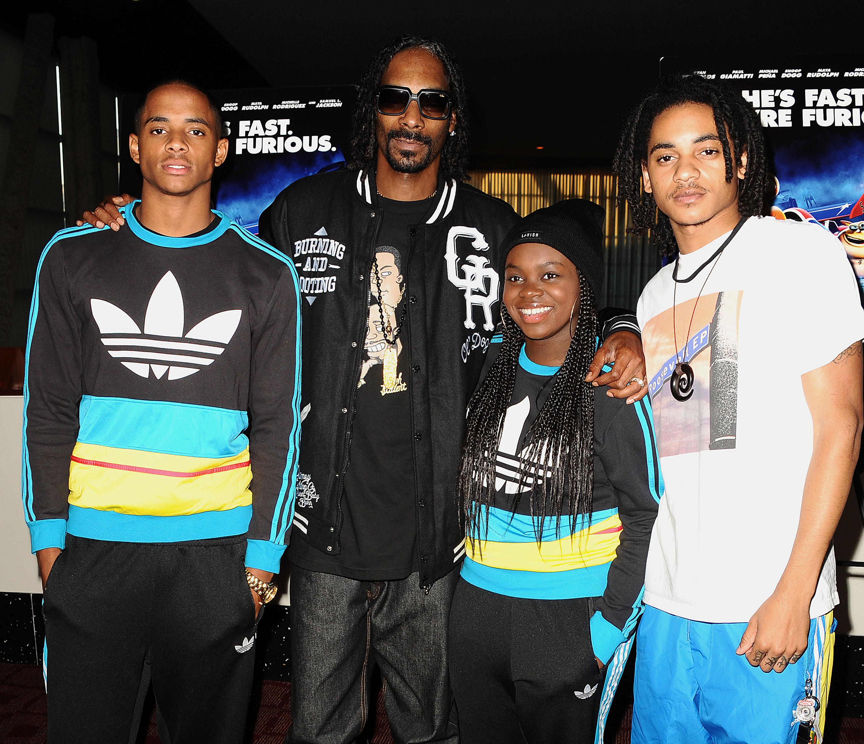 Snoop Dogg poses with his children Cordell, Cori, and Corde Broadus on July 16, 2013 | Source: Getty Images