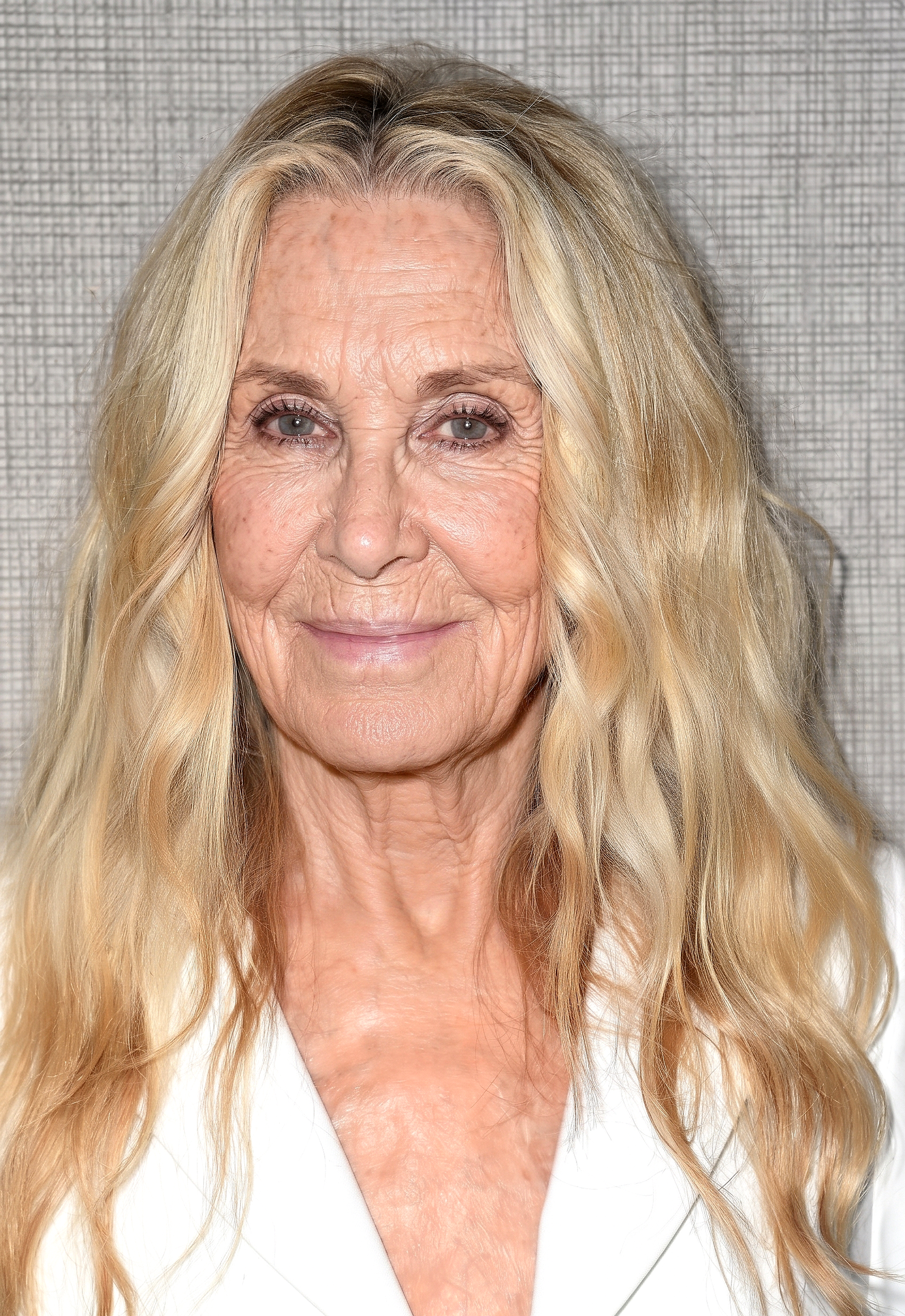 The first Gemini-generated portrait envisions Joan Van Ark with gently weathered features and a relaxed smile, offering a subtle interpretation of how she might have looked had she aged naturally while retaining the warmth and poise that made her a familiar face for decades. | Source: Gemini