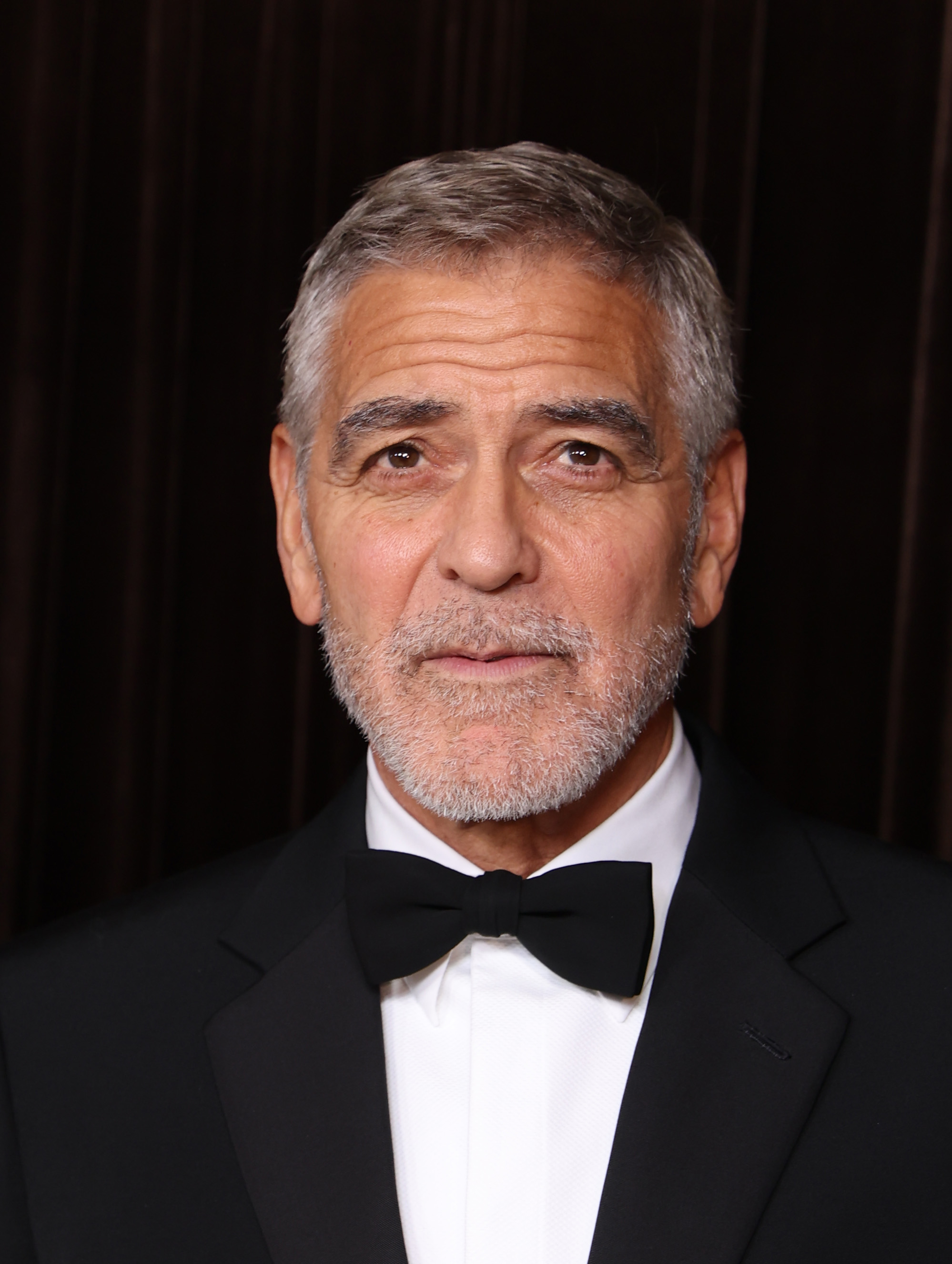 George Clooney attends The Albies, the annual awards ceremony hosted by the Clooney Foundation for Justice, where he spoke about the death of Presley Gerber. The actor appeared in a classic black tuxedo with a white dress shirt and black bow tie. | Source: Getty Images