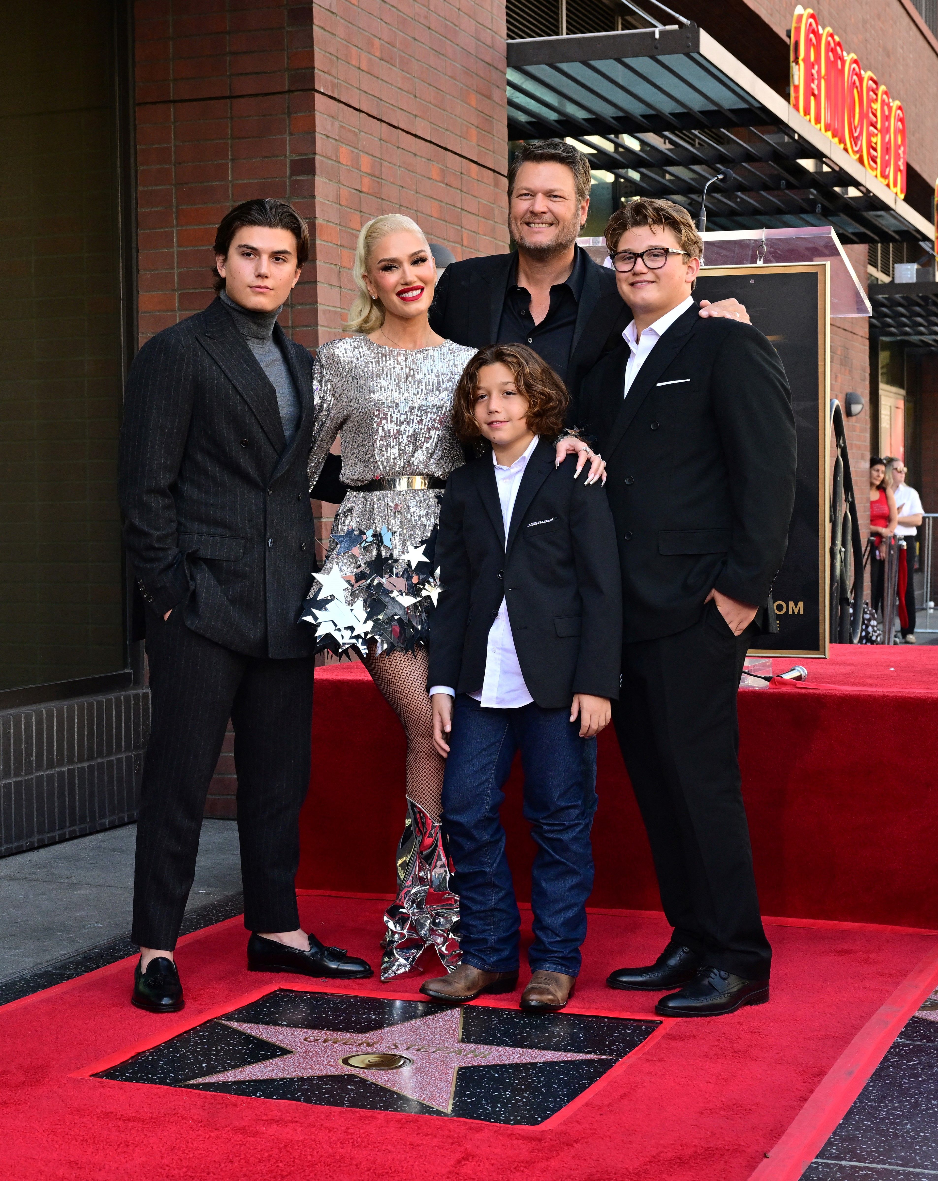 Gwen Stefani with Blake Shelton and Kingston, Zuma, and Apollo Rossdale on her Hollywood Walk of Fame Star during a ceremony in Hollywood, California, on October 19, 2023 | Source: Getty Images