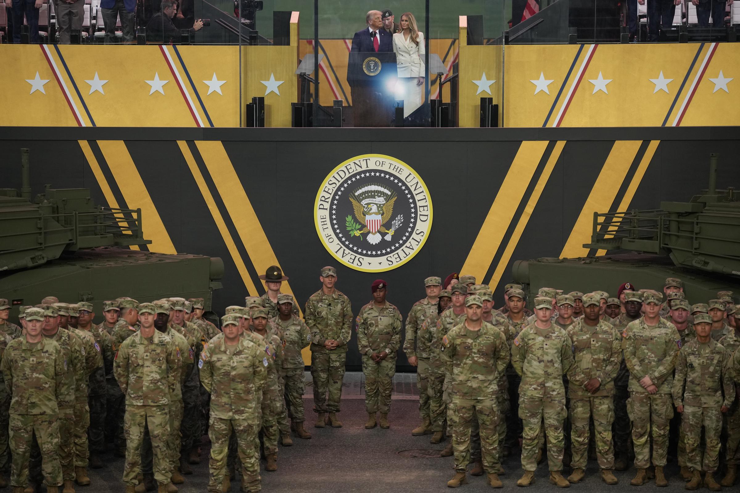 Donald and Melania Trump stand together at the end of the U.S Army parade | Source: Getty Images