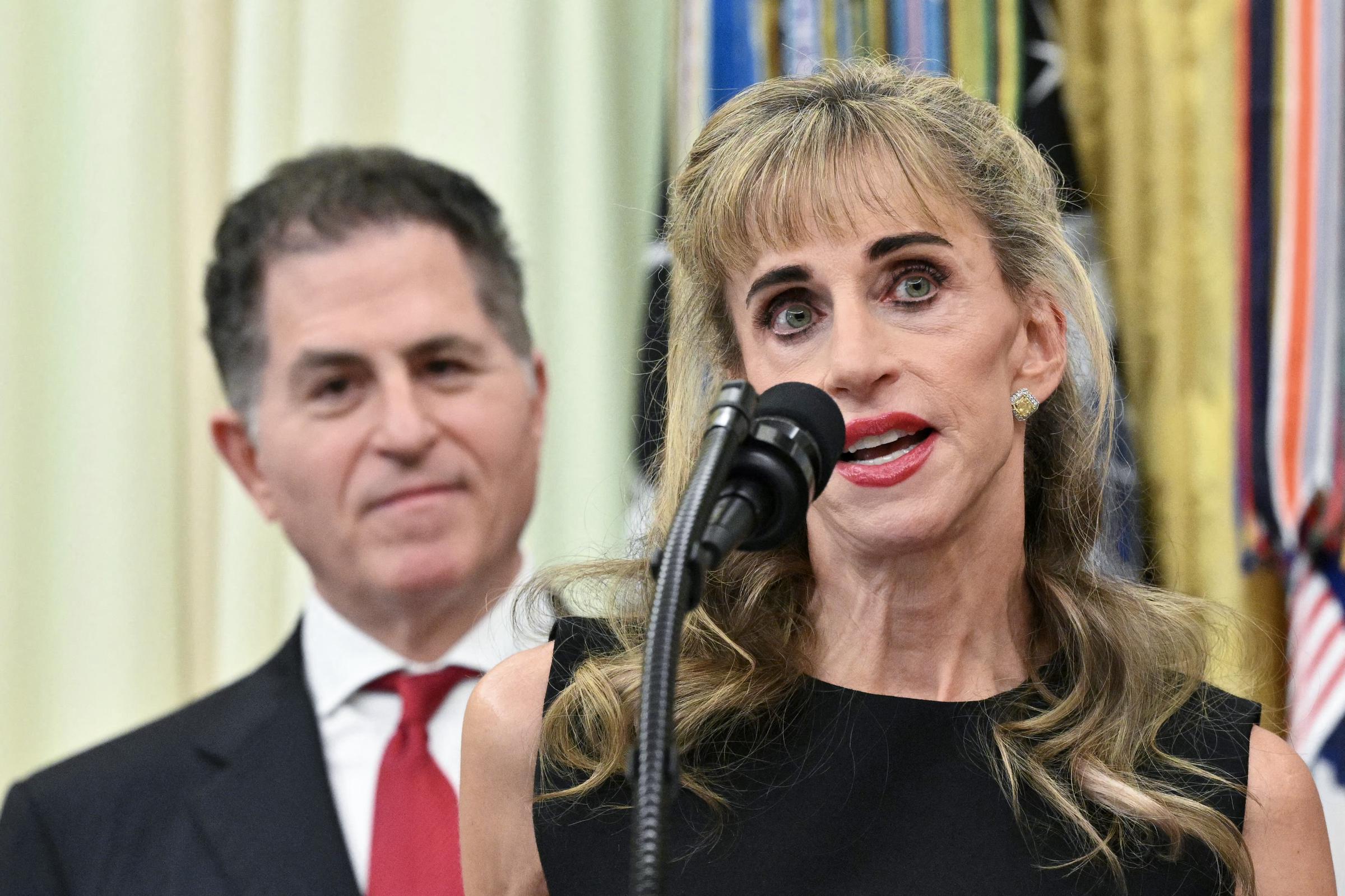 Susan Dell speaks during the launch of Trump investment accounts in the Oval Office of the White House in Washington, D.C. She addressed the room while her husband, Michael Dell, stood behind her.