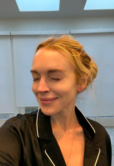 Lindsay Lohan posing for a makeup-free selfie, posted on August 20, 2025. | Source: Instagram/lindsaylohan