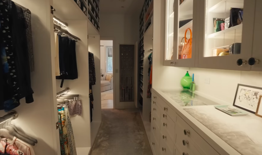 The closet is technically shared, but viewers immediately noticed that it is larger than many people's bedrooms. It is organized like a luxury boutique rather than a standard wardrobe. | Source: YouTube/Architectural Digest