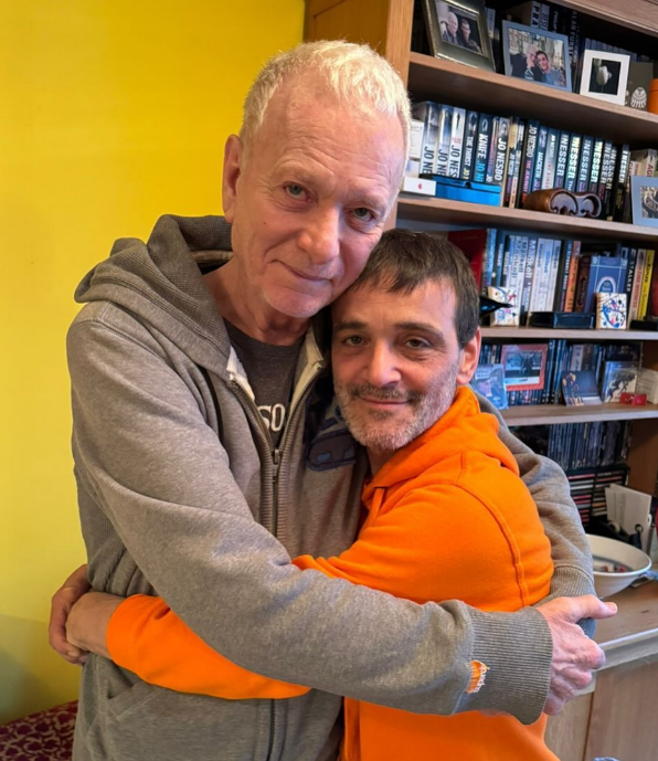 Anthony Geary and his husband Claudio Gama hugging in their home in Amsterdam, from a post dated May 30, 2024 | Source: Instagram/claudiogama_71