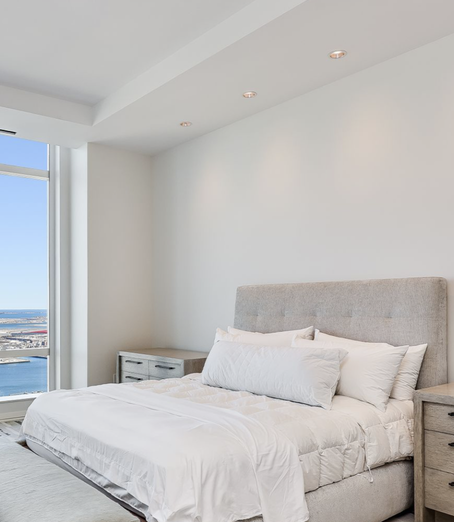 The penthouse’s primary suite includes a walk-in dressing room and a marble bathroom with a freestanding soaking tub. | Source: Instagram/@robbreport
