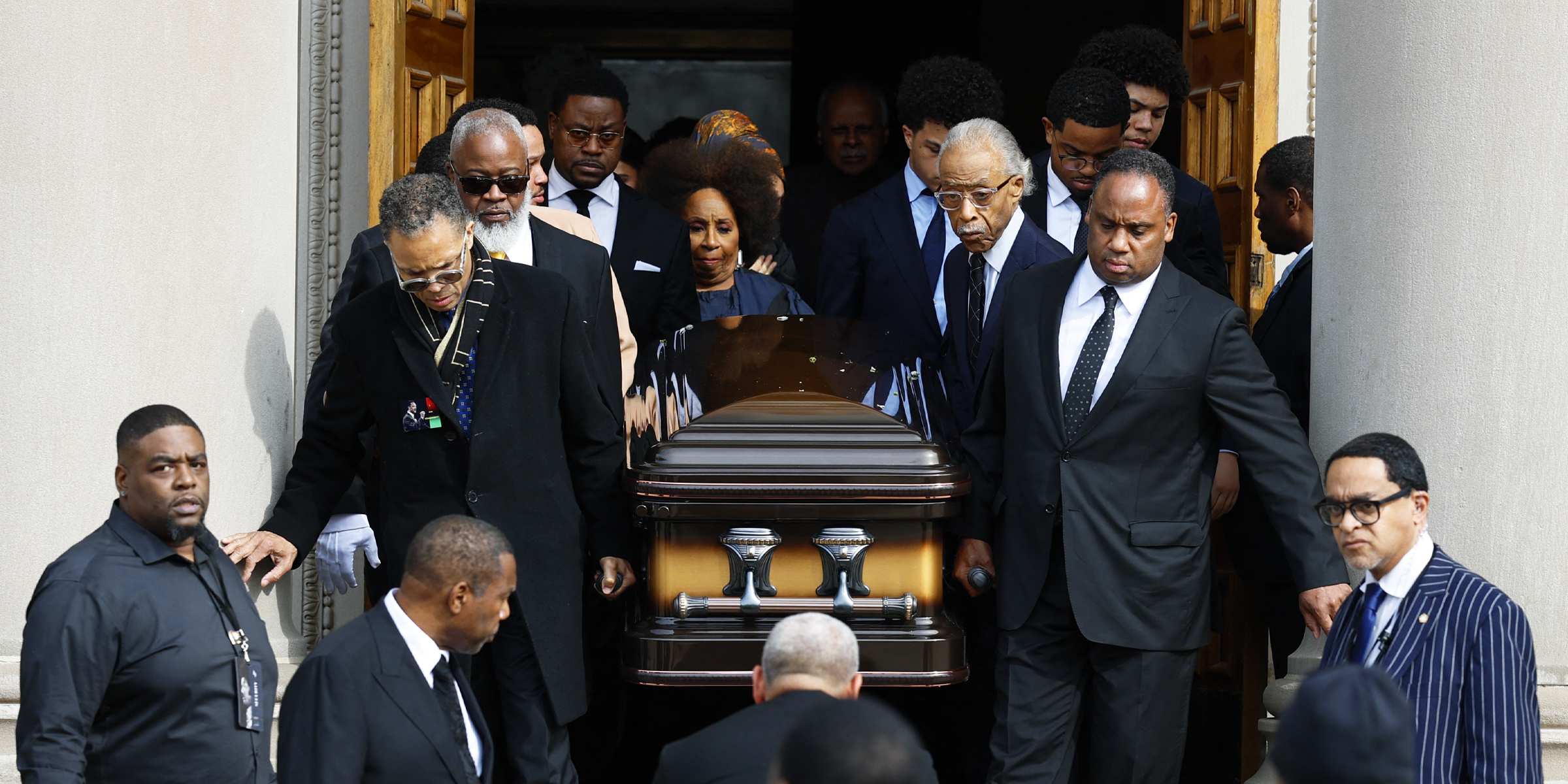 Esteemed funeral guests carrying the late Jesse Jackson's casket out of a church. | Source: Getty Images