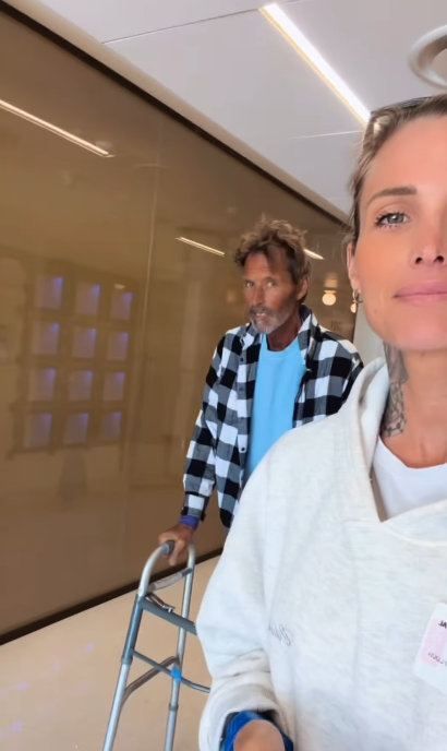 Duguay uses a walker in a hallway as Thomas records a video nearby. The moment shows the mobility difficulties he faced during a period when his family was closely monitoring his health. | Source: Instagram/mrs__shay