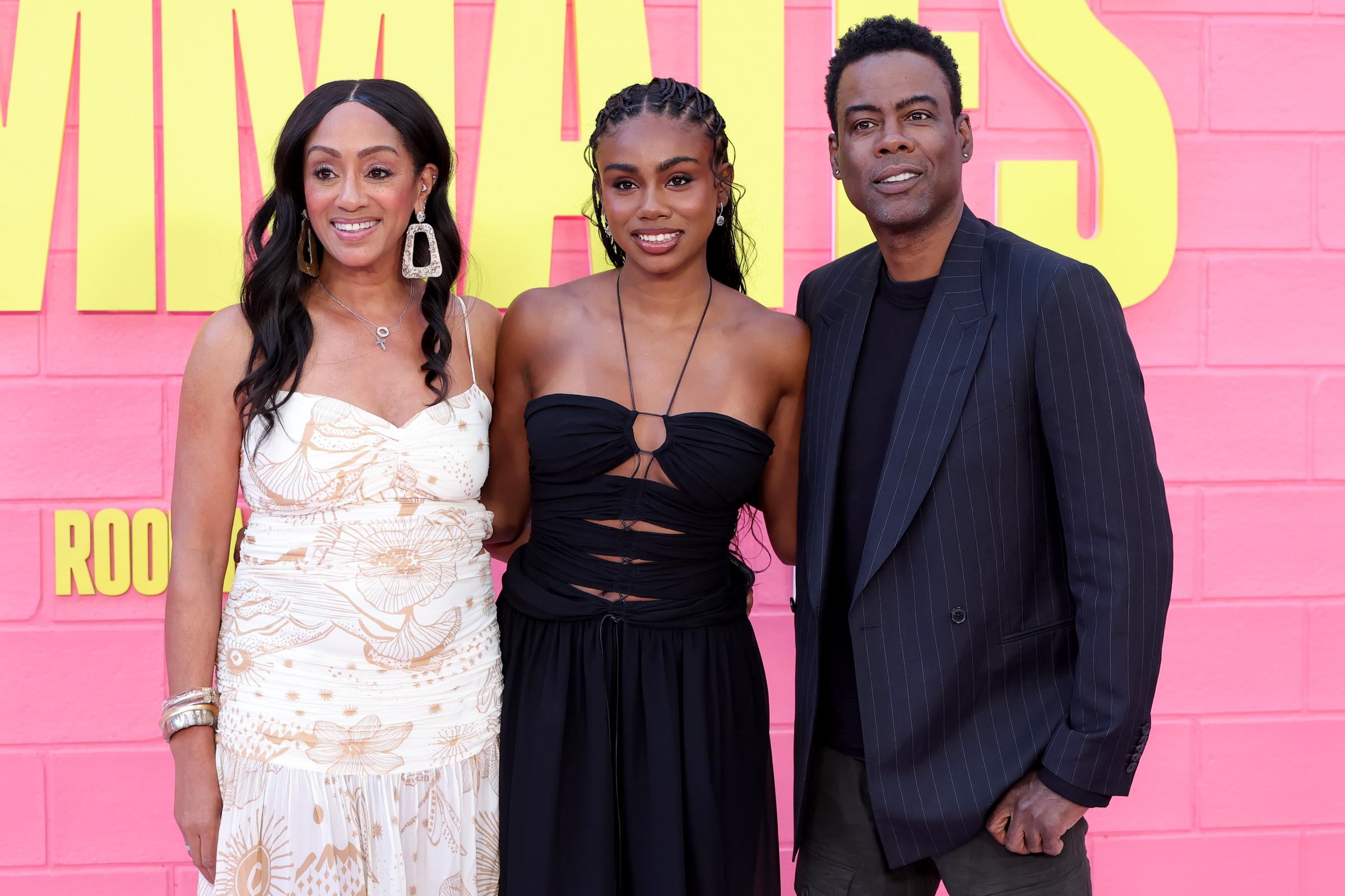Malaak Compton, Zahra, and Chris Rock attend the premiere of Netflix's "Roommates" on April 13, 2026 | Source: Getty Images