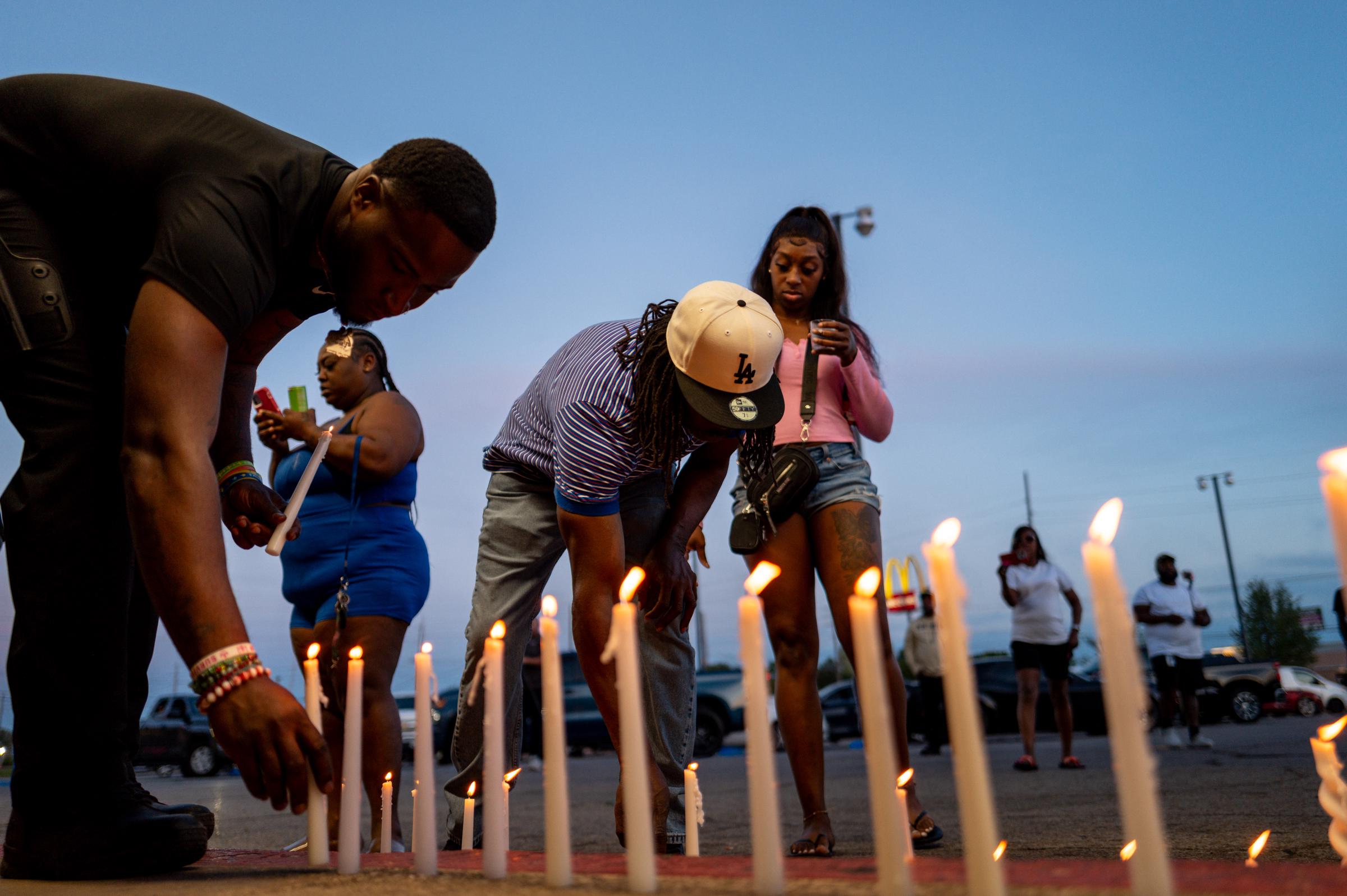 People attend a candlelight vigil in Shreveport, Louisiana on April 19, 2026. | Source: Getty Images