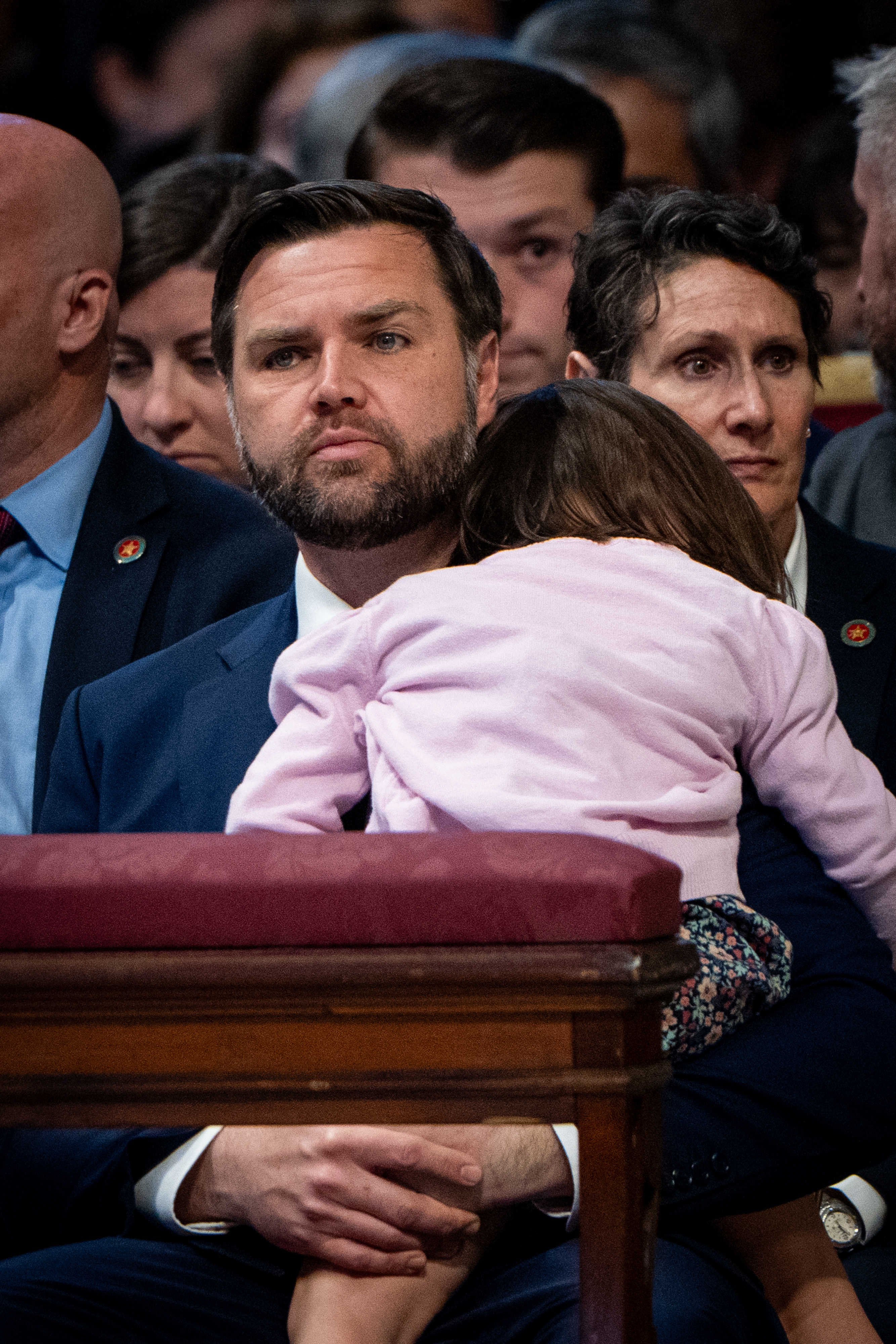 JD Vance holds one of his children during Good Friday Mass at St. Peter’s Basilica in Vatican City on April 18, 2025. | Source: Getty Images