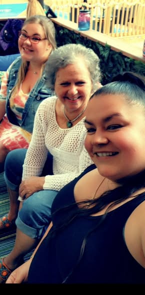 Lora Roberts, pictured at far right, beams alongside two friends in a happy moment captured before her untimely death. Loved ones remembered her as a "beautiful soul" whose kindness left a lasting impression. | Source: Facebook/maryann.lewis3