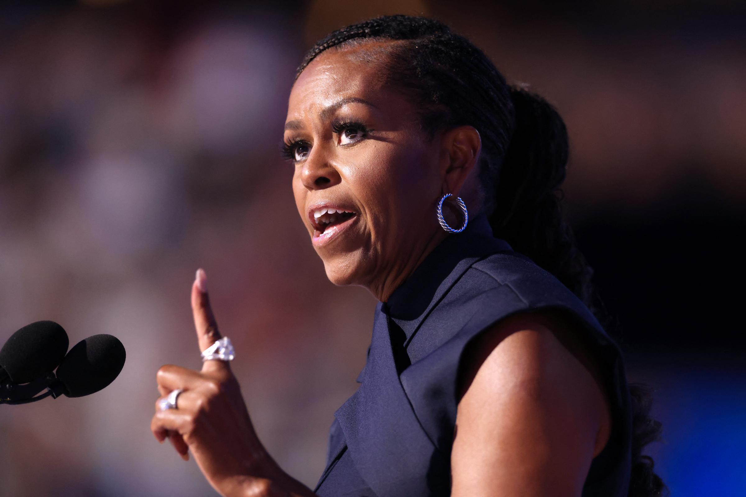Michelle Obama speaking onstage during the second day of the Democratic National Convention in Chicago, Illinois on August 20, 2024. | Source: Getty Images