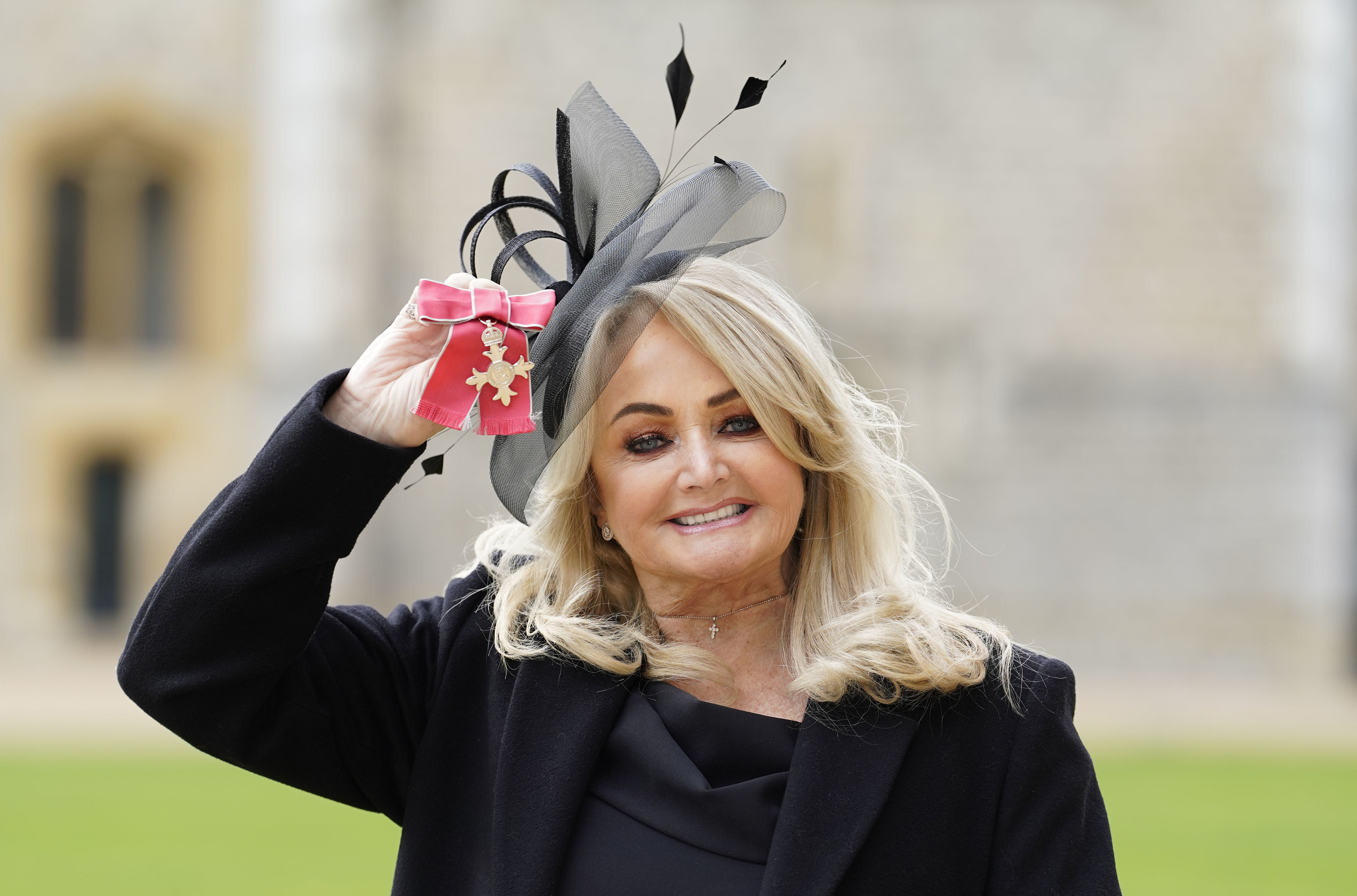 The fan claimed Robert Sullivan tried to get ahead of the confession by calling her crazy. At this event, Bonnie Tyler posed with her MBE after being made a Member of the Order of the British Empire by the Prince of Wales during an investiture ceremony at Windsor Castle on February 1, 2023, in Windsor, England. | Source: Getty Images