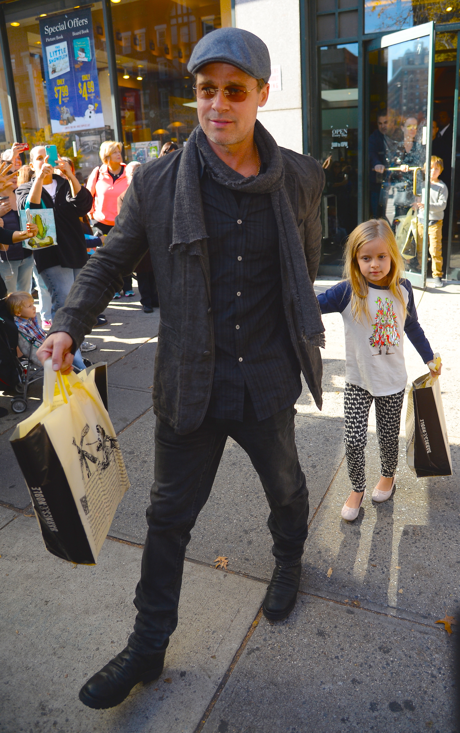 Brad Pitt and Vivienne Jolie-Pitt is seen coming of "Barnes & Noble in Midtown on November 3, 2015 | Source: Getty Images