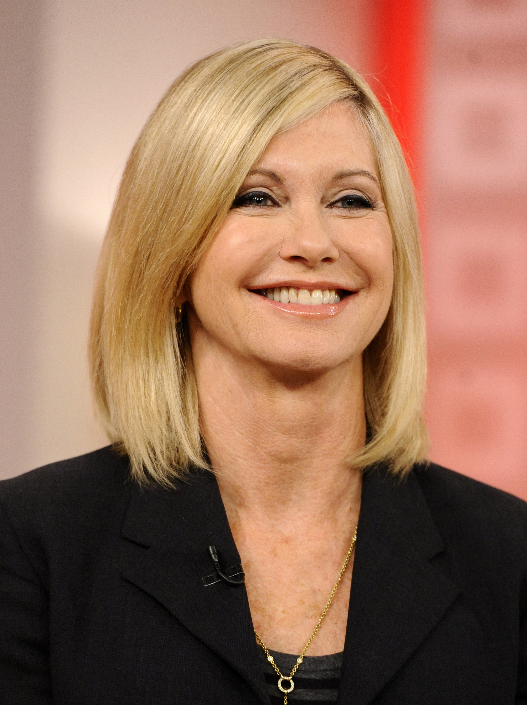 Olivia Newton-John at 62 years old. [Photo taken on October 18, 2010]. | Fun Fact: Olivia had some fun with her own pop-culture legacy in 2010 when she appeared on "Glee." She teamed with Jane Lynch's Sue Sylvester for a new version of "Physical," recreating and playfully updating the famous workout-themed video almost 30 years after the original became a phenomenon.