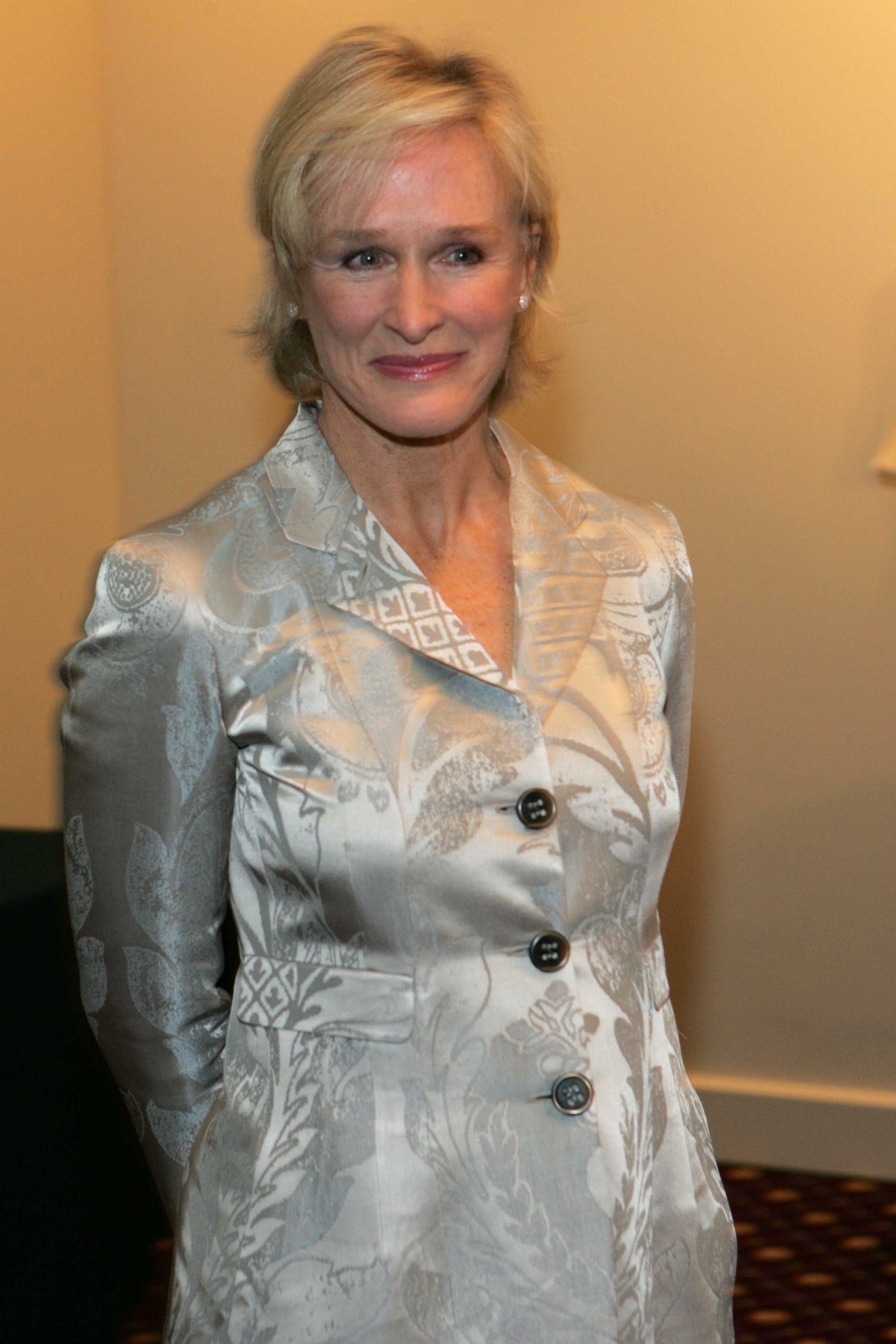 Glenn Close attends an awards event in New York City, standing against a neutral indoor backdrop in a composed pose | Source: Getty Images