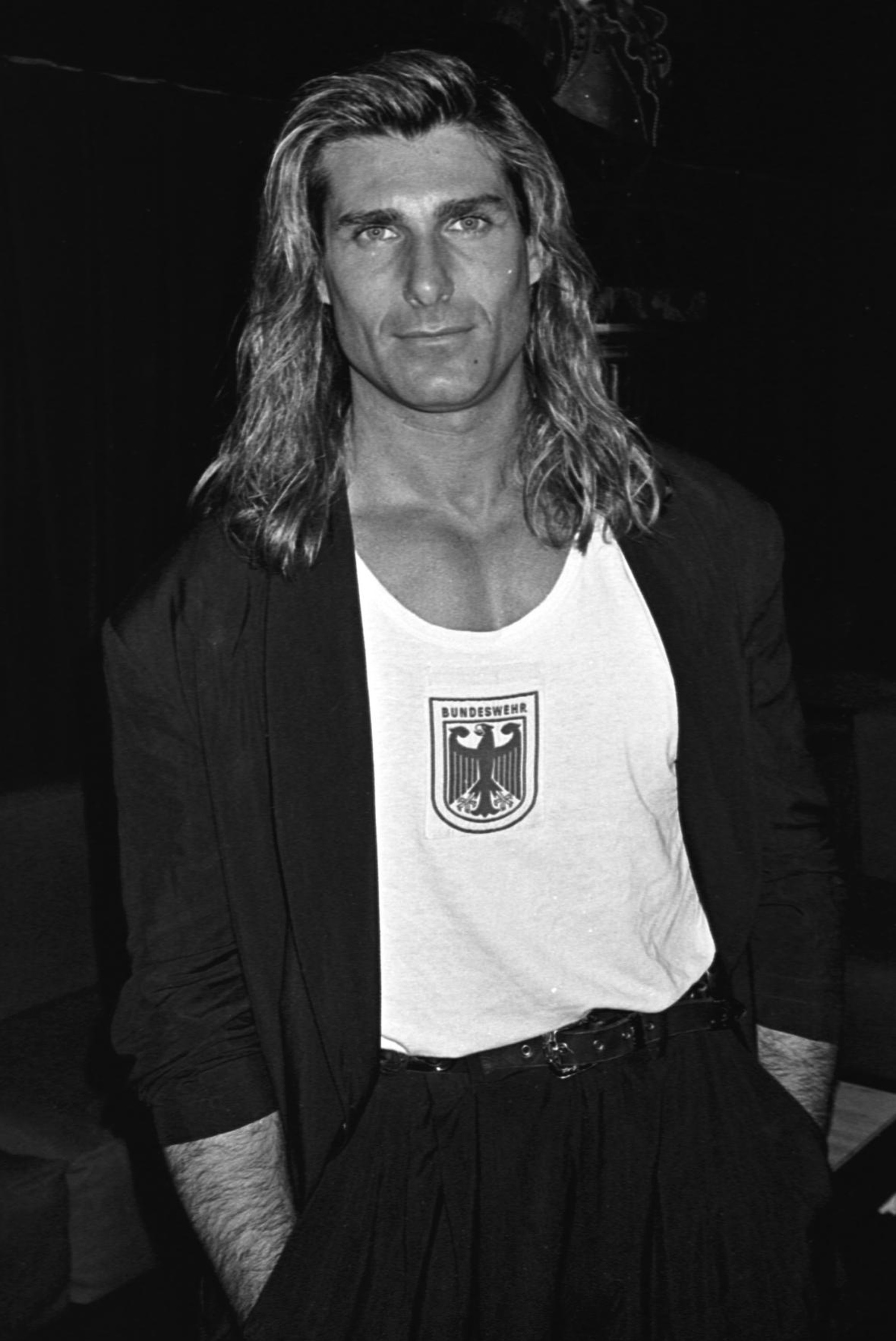 Discovered at just 14 years old, the iconic romance book cover star quickly became one of the most recognizable faces in the modeling world. In this photo, he posed at The Roxy in New York City, New York, in 1990. | Source: Getty Images