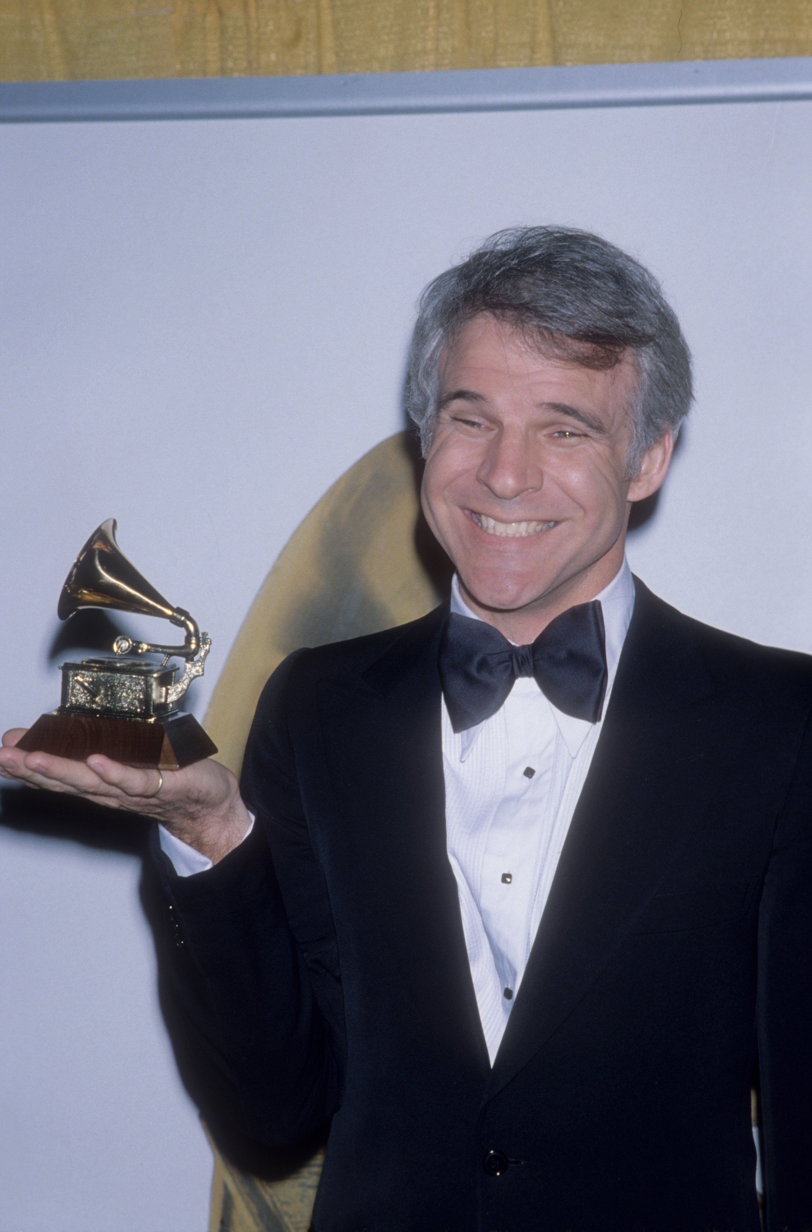 Steve Martin holding his Grammy award in Los Angeles, captured during a press moment | Source: Getty Images