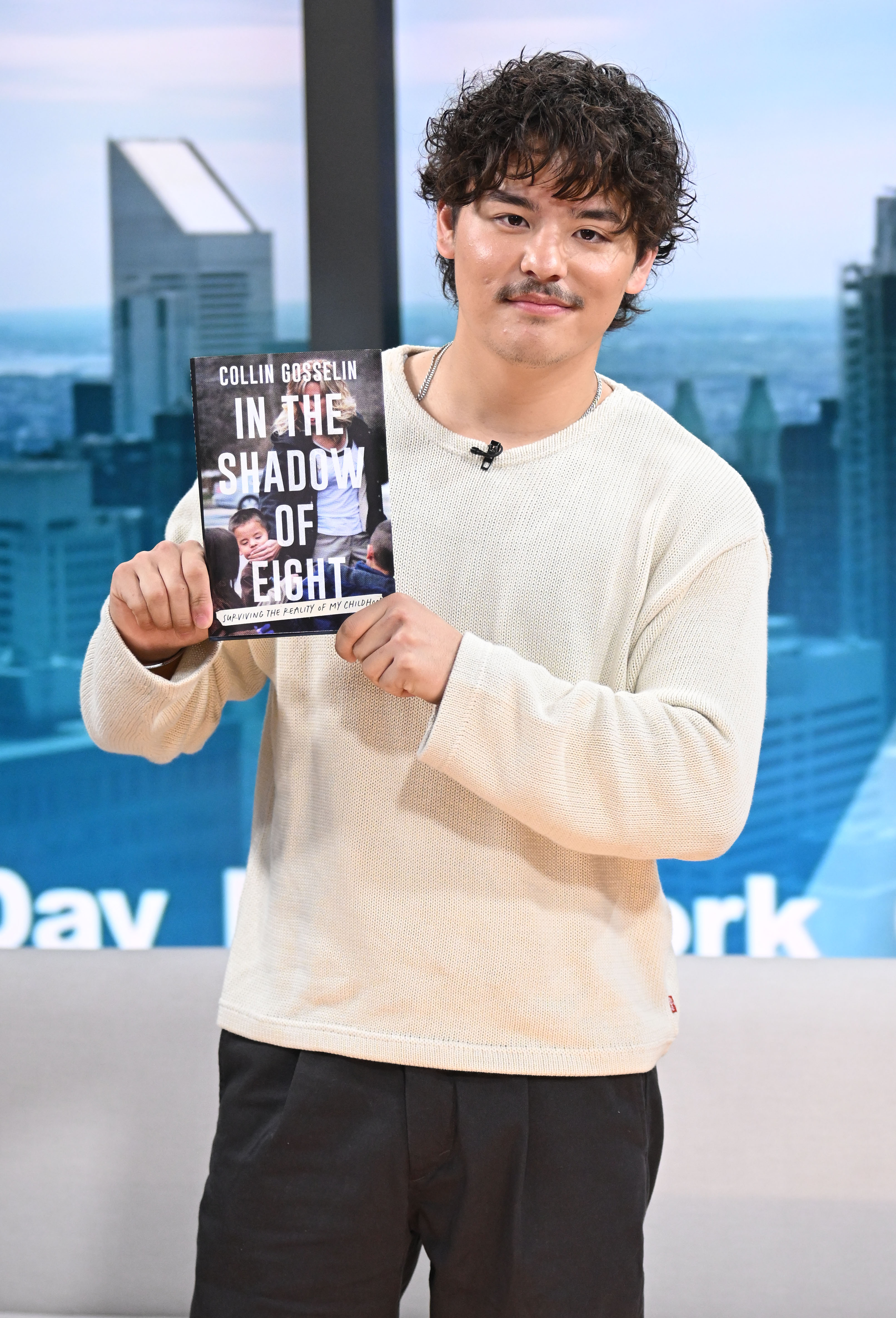 Collin Gosselin holds a copy of "In the Shadow of Eight," the memoir that prompted his father's emotional response. He promoted the book during a September 2026 appearance on "Good Day New York." | Source: Getty Images