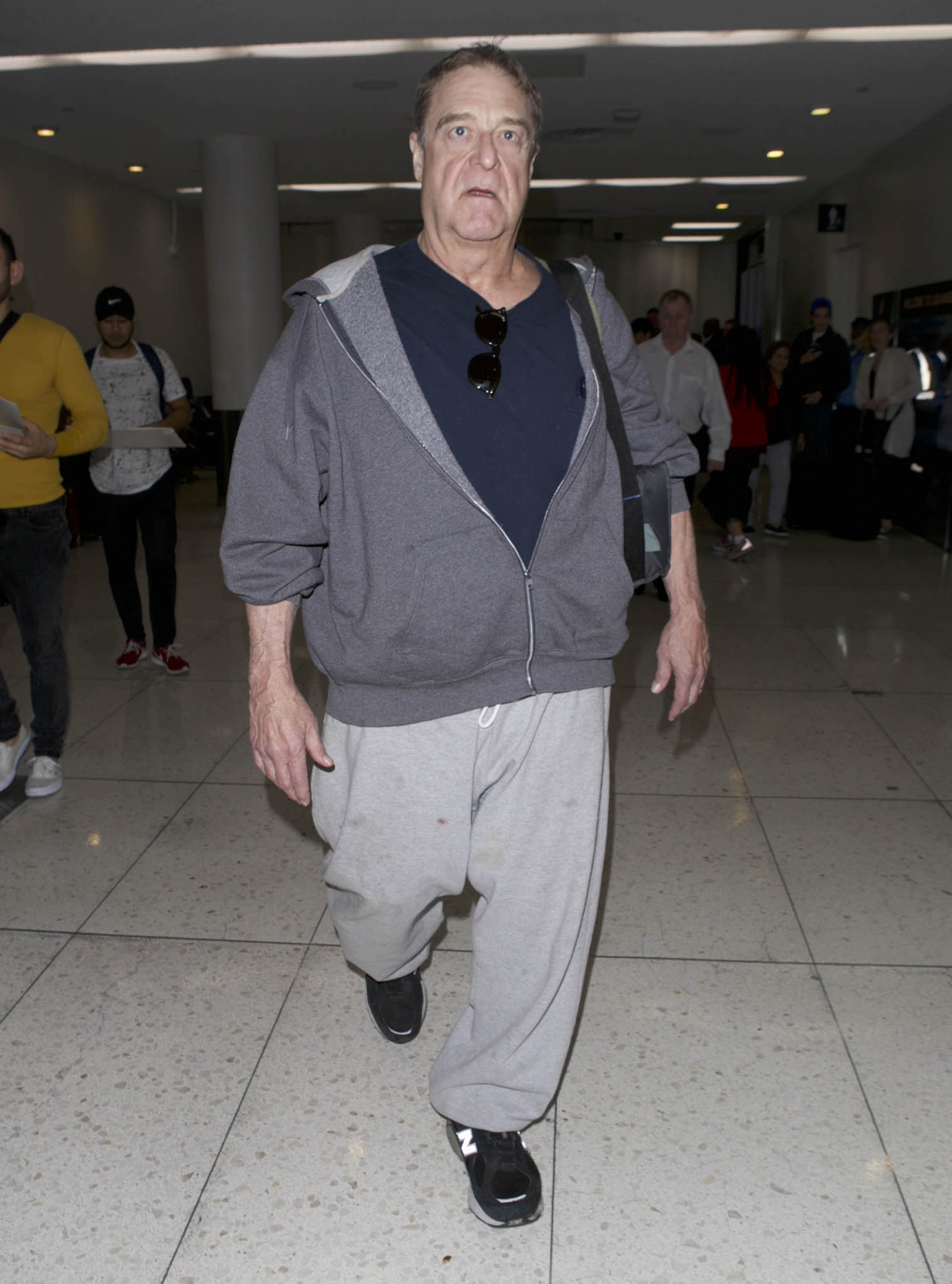Goodman was photographed in Los Angeles wearing a gray zip-up hoodie, dark shirt, and loose gray pants. The full-length candid provided a clear look at his continued transformation, years after he began publicly discussing his weight loss, sobriety, and lifestyle changes.