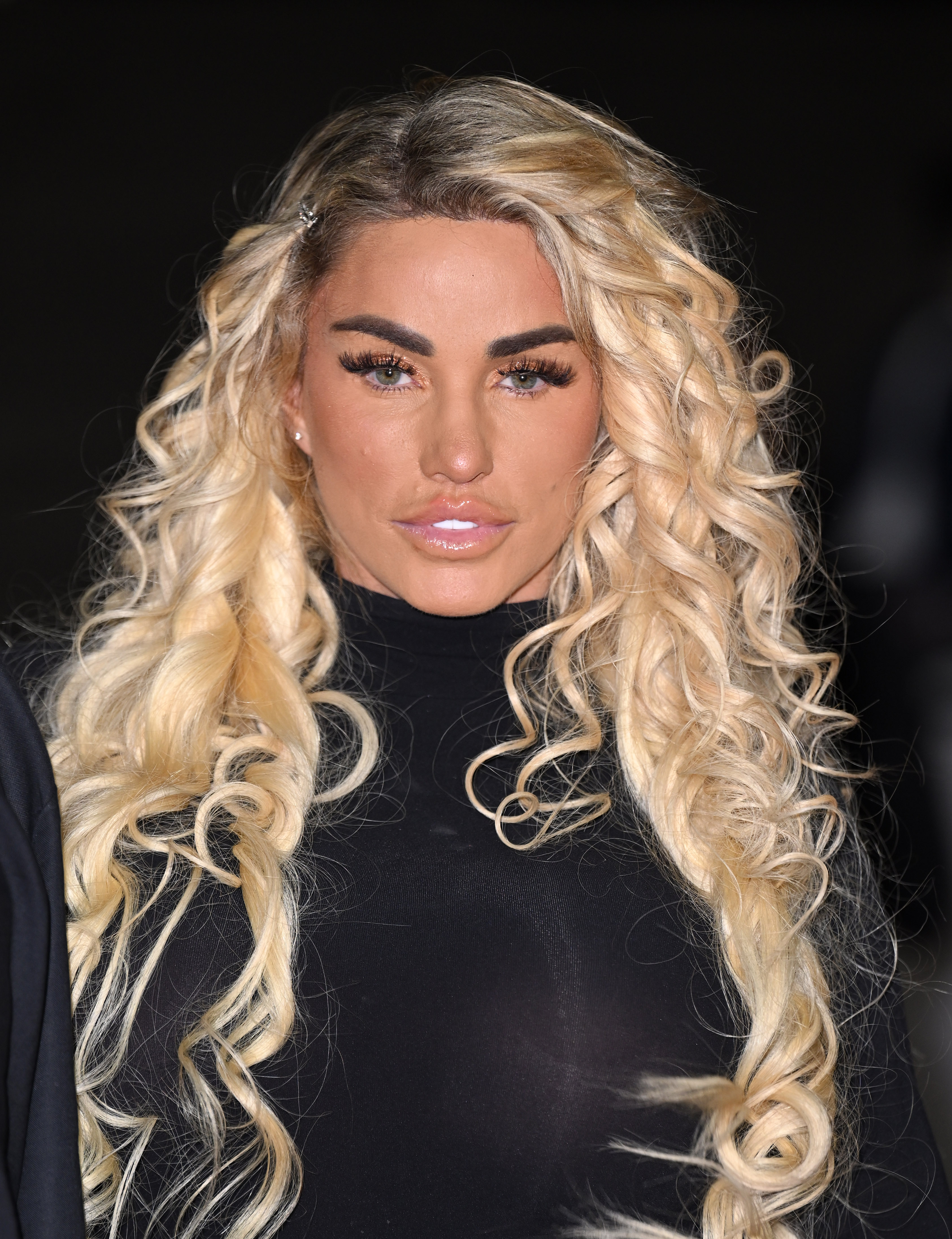 TV Royalty Returns — Price hits the 2022 NTAs in full force, with bombshell blonde curls and a figure-hugging black look, proving she's still got that headline-making magic.